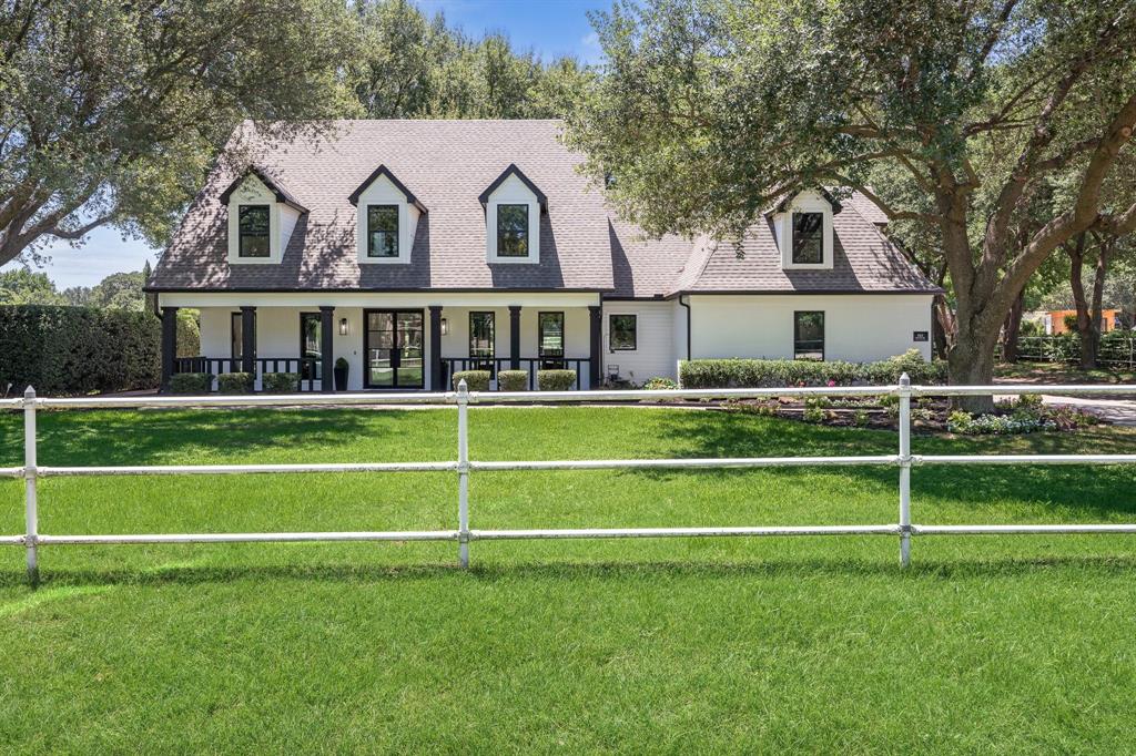 Experience the perfect balance where modern sophistication meets classic Texas charm at this beautifully reimagined property in the heart of Colleyville. Set on lush acreage shaded by mature trees, this exceptional property combines a fully renovated modern farmhouse with equestrian-friendly amenities—creating a rare offering in one of DFW’s most coveted communities.
Step inside to discover an open, airy floor plan where natural light pours through expansive windows, framing serene views of the grounds. The chef’s kitchen is the centerpiece of the home, featuring custom cabinetry, premium appliances, and a striking island that seamlessly connects to the living and dining areas. The living room is anchored by a sleek fireplace and flanked by built-in shelving, making it as stylish as it is inviting.
The first-floor primary suite offers a private retreat, complete with a spa-inspired bath featuring a soaking tub, dual vanities, and dramatic black-and-white marble. Upstairs, you’ll find three additional bedrooms, a spacious family room with a bar, and flexible space for relaxation or play.
Work-from-home days are elevated by the dedicated office, while wide-plank hardwood floors throughout bring warmth and continuity to every room.
Outside, the property opens up to an expansive patio perfect for entertaining, a fenced pasture, and a well-maintained barn with stalls, ideal for horses or hobby livestock. The land offers endless possibilities—whether you dream of gardening, riding, or simply enjoying the peaceful setting beneath the shade of mature oaks.
Located just minutes from top-rated Colleyville schools, shopping, and dining, yet offering the privacy and space of true country living, 511 Shelton Drive is more than a home—it’s a lifestyle.