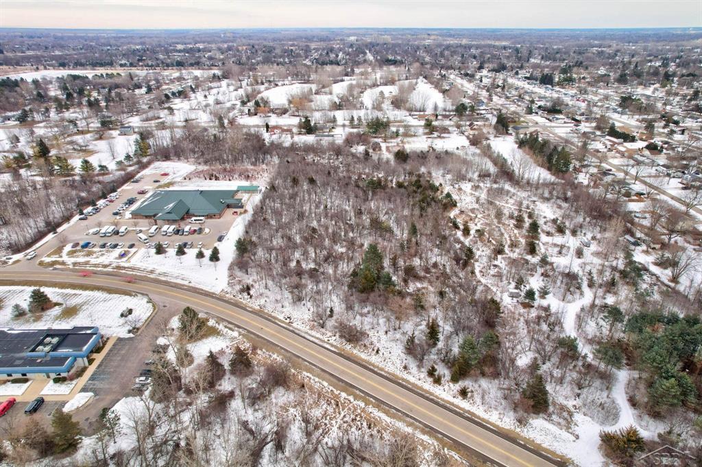 Presenting an exceptional opportunity: 6.15 acres of prime commercial land available for development just off Fashion Square Boulevard in Saginaw, Michigan. This expansive parcel offers a versatile canvas for a variety of commercial ventures, strategically positioned to capitalize on the area's dynamic growth and accessibility.  Key Features:  Strategic Location: Situated adjacent to Fashion Square Boulevard, the property benefits from high visibility and easy access to major thoroughfares, including I-675 and Tittabawassee Road, facilitating seamless connectivity to the broader Great Lakes Bay Region.  Proximity to Amenities: The land is in close vicinity to Fashion Square Mall, a premier shopping destination featuring a diverse mix of retailers and dining options. Additionally, the area hosts a variety of hotels, office complexes, and entertainment venues, enhancing the appeal for potential developments.  Zoning and Land Use: commercial and light commercial this parcel is ideal for a range of developments such as retail centers, office buildings, hospitality projects, or mixed-use complexes. The zoning designation provides flexibility to tailor the project to specific business objectives.  Infrastructure: The site is equipped with essential utilities, including water, sewer, electricity, and gas, streamlining the development process and reducing initial setup costs.  Economic Environment: Saginaw's robust economic landscape, coupled with ongoing community investments, fosters a conducive environment for business growth and expansion. The property's location within a thriving commercial hub positions it advantageously for future success.  This 6.15-acre tract presents a rare opportunity to establish a significant presence in one of Saginaw's most sought-after commercial corridors.