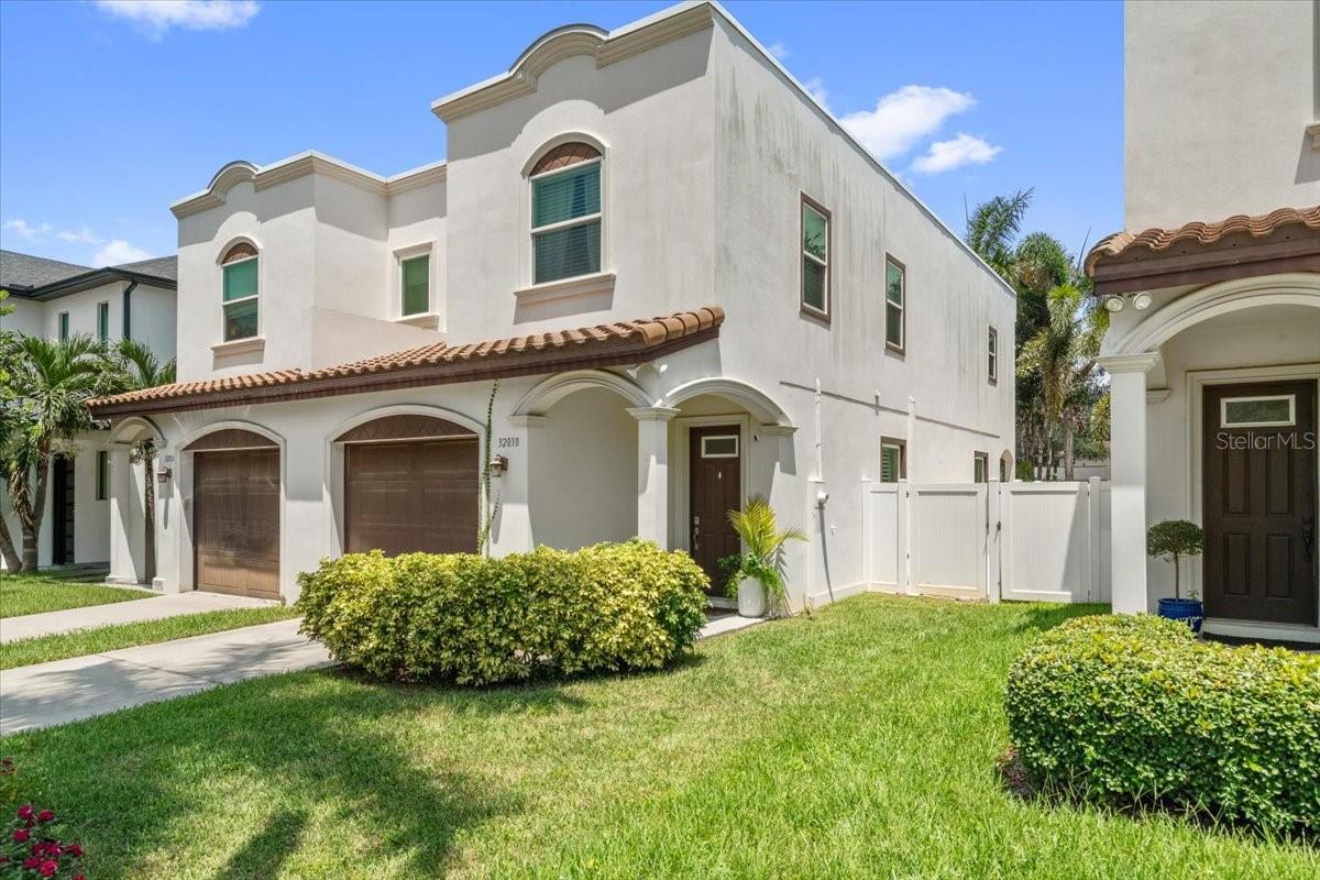 NO HOA in the heart of Palma Ceia! Enjoy the space and privacy of a single-family home with the convenience of townhome living in one of Tampa’s most sought-after neighborhoods. This beautifully maintained Mediterranean style home is ideally located just minutes from some of Tampa’s best dining, shopping, and entertainment and only about a half mile from scenic Bayshore Boulevard. Step inside to high ceilings, rich hardwood floors, crown molding, plantation shutters, and a bright, open concept floor plan designed for both everyday living and entertaining. The spacious kitchen features crisp white cabinetry, abundant storage, generous counter space, and a large pantry. The open living and dining areas provide the perfect setting for gatherings and your annual Gasparilla celebration. Upstairs, the spacious primary suite features a large wardrobe closet and beautifully appointed bath with a double vanity. Two additional generously sized bedrooms, a second full bath, and conveniently located upstairs laundry complete the second floor. Built in 2014, this home offers a rare combination for Palma Ceia, NO HOA, a private fenced backyard, and low maintenance outdoor living. The backyard features artificial turf and pavers, creating an inviting private oasis for relaxing, entertaining, or enjoying Florida’s year-round sunshine. Move in ready and located in a highly desirable school district, this is a rare opportunity to enjoy the very best of the Palma Ceia lifestyle! Schedule your showing today!