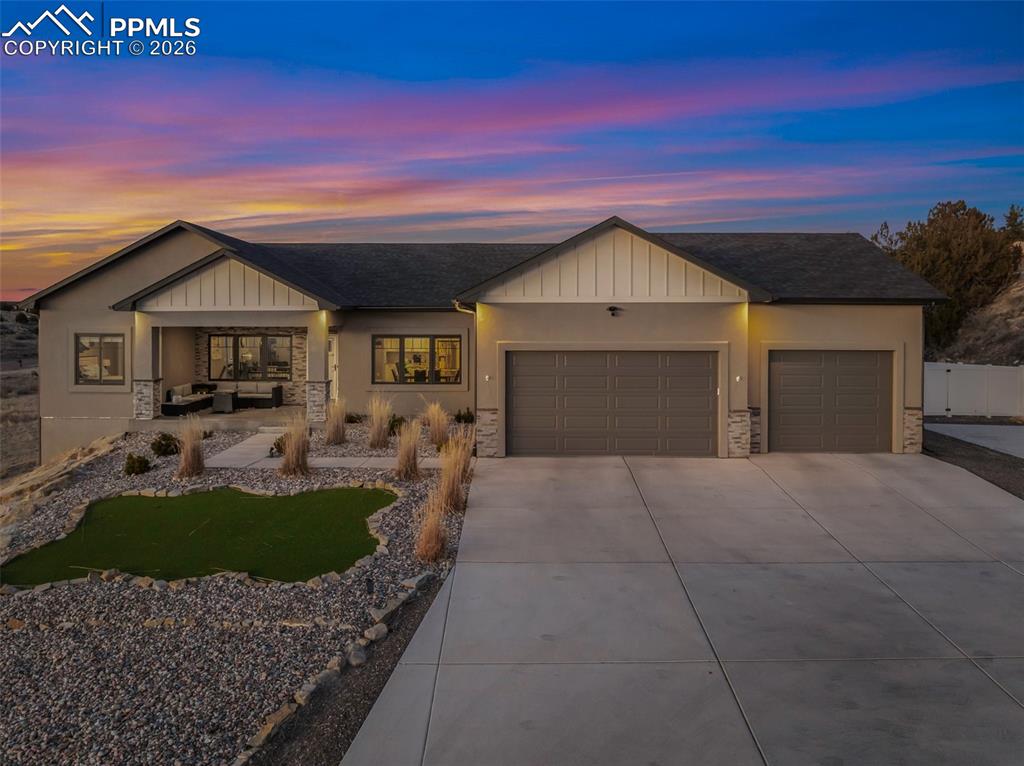 Your dream home is now available in Pueblo West! Prepare to fall in love with this gorgeous single-owner Liberty Point home, built in 2021 with 6 bedrooms, (plus office), 4 bathrooms, with over 4000 square feet, and an oversized 3-car attached garage! Perched high on a 1.21 acre parcel, with concrete driveway, RV parking, and excellent views of Pueblo Reservoir and the surrounding mountain ranges. Step inside to discover the airy and open-concept floor plan with lofted ceilings and a large gourmet kitchen with granite countertops, marble mosaic tile backsplash, stylish pendant and LED lighting, kitchen island with breakfast bar, durable laminate flooring, and a corner pantry. All stainless-steel kitchen appliances are included! Enjoy the sunny dining area, and the beautiful modern gas fireplace in the living room complete with mantle and stone hearth. The split-bedroom layout features a spacious primary bedroom suite, with a huge walk-in closet, 5-piece bath with separate soaking tub and roomy walk-in shower. Step outside to the back patio to enjoy the private backyard and stunning views, featuring water-friendly artificial grass and easy-to-maintain vinyl fencing. Sprinkler system is installed in the backyard if needed for a future lawn, and drip lines service the bushes in the xeriscaped front yard and trees in the back. More reasons to love this home - efficient Anderson windows with electric blinds, central air conditioning, Rinaii tankless hot water heater, stamped concrete covered porch, and granite in all bathrooms! Also features 9’ ceilings in the full basement with large family room, 3 more bedrooms, plus an office/work-out/bonus room (could be 7th bedroom, has egress, but no closet), and plenty of extra storage in the 519 sq ft unfinished utility/storage room. Come see for yourself—this home is in pristine, like-new condition, and is move-in ready for its next lucky owner!