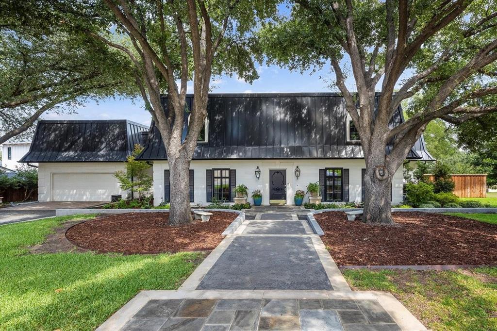 Situated on a spacious corner lot just under half an acre, this beautifully renovated two-story home offers 5,074 SF, including a 4,289 SF main residence and a private 785 SF guest cottage.
The main house was extensively remodeled in 2020 with all new HVAC, plumbing, electrical, PELLA windows, tankless water heaters, and a 2023 roof. The first floor features 9-ft ceilings, French oak hardwoods, travertine, marble, and designer finishes. The open-concept living area includes a Control4 smart home system and a 36” gas fireplace. The gourmet kitchen boasts a Sub-Zero refrigerator, Wolf 6-burner cooktop and double ovens, Bosch dishwasher, warming drawer, microwave drawer, wine fridge, oversized island, and coffee-dry bar. The home offers 5 bedrooms, including a luxurious first-floor primary suite with spa-inspired bath, plus a flexible fifth bedroom currently used as an additional living room.
Completed in 2020, the 785 SF guest cottage is ideal for multigenerational living, with a full kitchen, laundry, sitting room, bedroom, and accessible bath with curbless shower. Separate tankless water heater and HVAC service for guest house , American hickory hardwoods, PELLA windows, and custom window treatments make it move-in ready.
Additional highlights include a sprinkler system, underground drainage, buried electrical lines, mature trees, and new gutters with leaf guards. Zoned to Overton Park Elementary, this rare property combines neighborhood charm with the comfort and efficiency of a nearly new build.