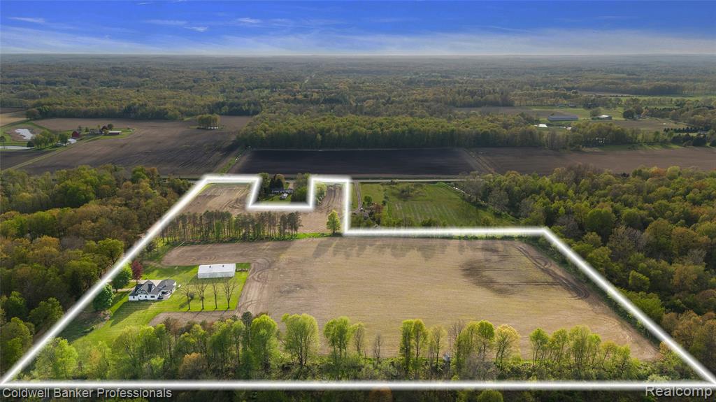 Back on the Market!!! Absolutely stunning home and property!  A total of 22 acres surrounds this beautiful 2500 sqft, 3 bed, 3 bath home.  Looking for a Hobby Farm?  This is it! Bring your horses/goats/pigs/etc., small farming operation, or bring your quads or ATV's! The 45x70 pole barn, with cement floors and electricity, will more than accommodate your needs.   There is plenty of room for it all!  The house has been completely updated with high end finishes.  Custom cabinetry and granite counter tops in the kitchen that makes for a perfect entertaining space.  The natural stone fireplace completes the coziness of the family room.  2 bedrooms downstairs connected by a full bath with custom tile and heated floors and shower.  1st floor laundry, as well as additional space on the first floor with a living room and an office/library.  The entire upstairs makes up the amazing primary suite. Pamper yourself in this magical space. A walk-in closet, dressing room, sitting room, and a huge bathroom with custom tile heated floors, walk-in tile shower, and dual vanities.  Spend your evenings peacefully on the 13x15 back covered patio that overlooks the property and watch the wildlife! This home is a must see. New roof in 2024.  Hot Tub is excluded.  Property is also offered with less acreage if interested. Seller is willing to sell home and just 6 acres which is listed at $565,000, please refer to MLS #20251022721.