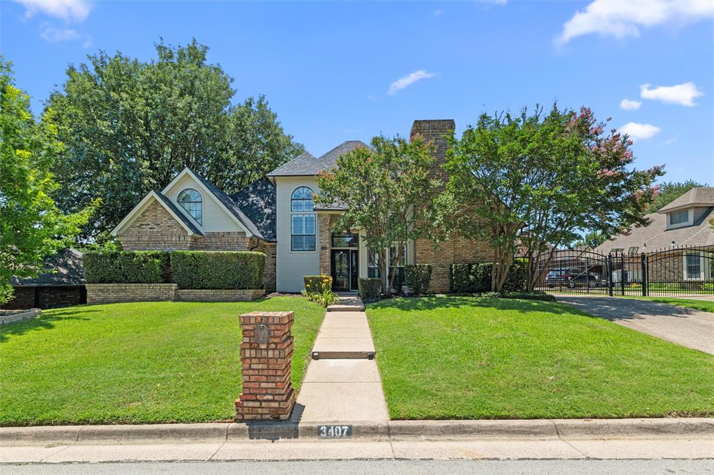 BUYER’S FINANCING FELL THROUGH. Beautifully landscaped home in desirable Colleyville neighborhood. This home is within the sought after Grapevine-Colleyville School District. You will find inviting property features such as solid wood flooring, plantation shutters, and a spacious living and dining area. The second living space offers a full wall of windows with views of the private backyard oasis and French doors leading to the oversized swimming pool. The eat-in kitchen boasts all-recently updated appliances, a wine refrigerator, fresh paint, and a breakfast bar for additional seating. The primary suite is conveniently located on the first floor, featuring a large Jacuzzi tub, a separate shower and has been updated with fresh paint and recently replaced countertops. The Upstairs landing features a desk area with built-ins, making it a great area for kids homework or anything else needed. The two upstairs bedrooms feature a Jack and Jill bathroom. The backyard covered patio area is large enough to accommodate a table and chairs and extra loungers, making it great for entertaining family & friends. This home offers a private rear entry garage with an electric gate, providing extra security and additional parking.