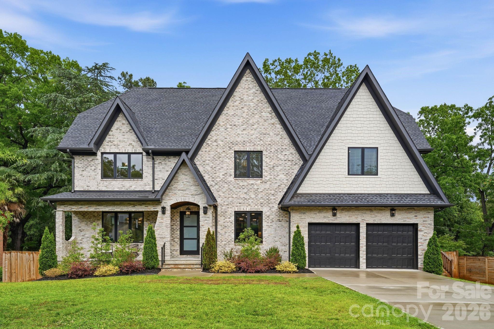 Luxury, location, and timeless design converge in this exceptional newly constructed estate nestled in the heart of Charlotte’s coveted Cotswold neighborhood. Spanning over 5,700 square feet, this stunning 2-story basement home was thoughtfully designed for both sophisticated entertaining and comfortable living. A grand foyer welcomes you into light-filled interiors accented by designer finishes, expansive living spaces, and seamless flow throughout. The chef’s kitchen serves as the centerpiece of the home, featuring premium appliances, custom cabinetry, an oversized island, and open-concept gathering spaces ideal for hosting on any scale. Upstairs, the luxurious primary suite offers a private retreat complete with a spa inspired bath, refined finishes, and an expansive walk in closet. Spacious secondary bedrooms provide comfort and privacy, while the fully finished basement delivers incredible versatility with additional living space, a second kitchen, guest suite, recreation areas, and endless possibilities for multigenrational living, entertaining, or a private retreat. Set within one of Charlotte’s most sought-after neighborhoods, this exceptional property offers the rare combination of luxury new construction, prime location, and refined modern living.