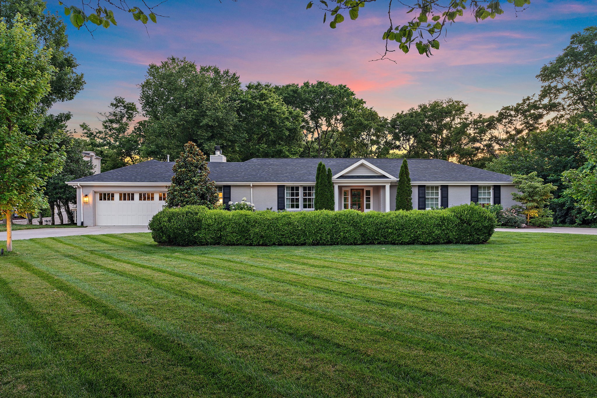 Just minutes from Green Hills, this stunning 4 BR / 3 Bath home—fully updated in 2019—sits on a flat 1.18-acre lot, offering privacy and a spacious backyard in the highly sought-after Julia Green Elementary school zone. The inviting outdoor living area, complete with a fireplace, is perfect for entertaining. Ample storage includes a generous walk-in space, attic, and garage. Recent architectural plans by Mike Marchetti (featured in the media section) offer options for expansion or the addition of a pool. A spacious circular driveway provides ample parking and space for outdoor activities. Inside, the renovated family room features soaring ceilings and an open layout, perfect for gatherings. Large windows flood the home with natural light, creating a bright and airy ambiance. Other benefits included within the one-level luxury are built-in Sonos speakers, reverse osmosis water filtration, and an irrigation system. Conveniently located near top-rated schools, shopping, and dining, this home seamlessly blends comfort, style, and functionality. You will be in awe of the backyard and all of the space it provides for outdoor activities this summer!