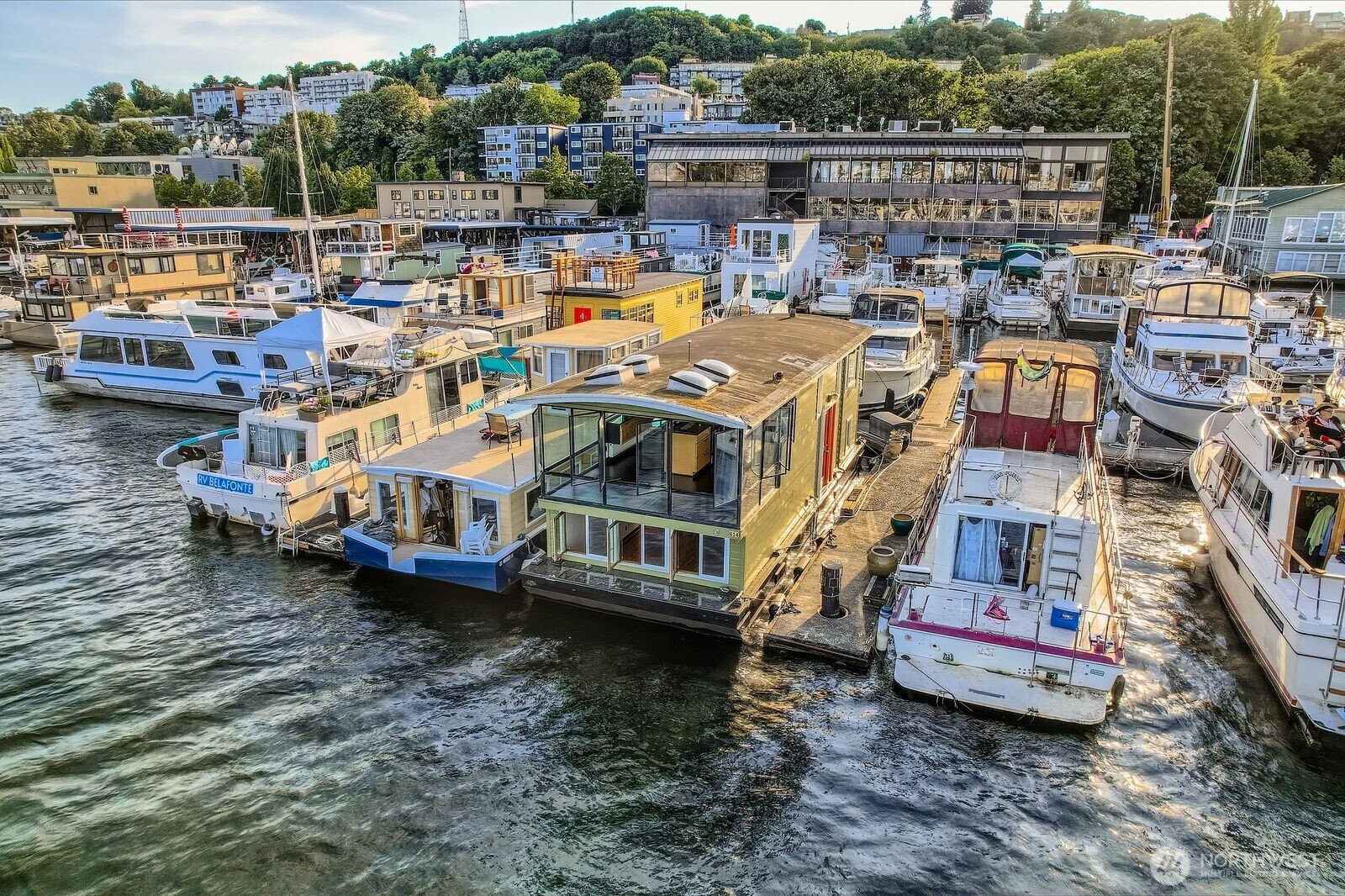 Step aboard a whimsical, artist-inspired 2BR/1BA Seattle Houseboat~one of Seattle’s original City-Registered Housebarges. Located on a desirable outer dock with a leased slip and unobstructed Lake Union views through a wall of windows. Upper level features grand artistic pillars, an open living/dining/kitchen with granite counters and newly refinished floors. Walk or bike to Google, Adobe, Amazon, UW, Fremont Market, dining, transit, and light rail. Just hauled out, pre-inspected, and ready for its next owner. Financing available. RPZ off-street parking included. Pets ok, pre-inspected with haulout done June 2025 and floors refinished, ready for its new homeowner.  Moorage includes Utilities of $1,250 /mo. Bring your water toys and relax.