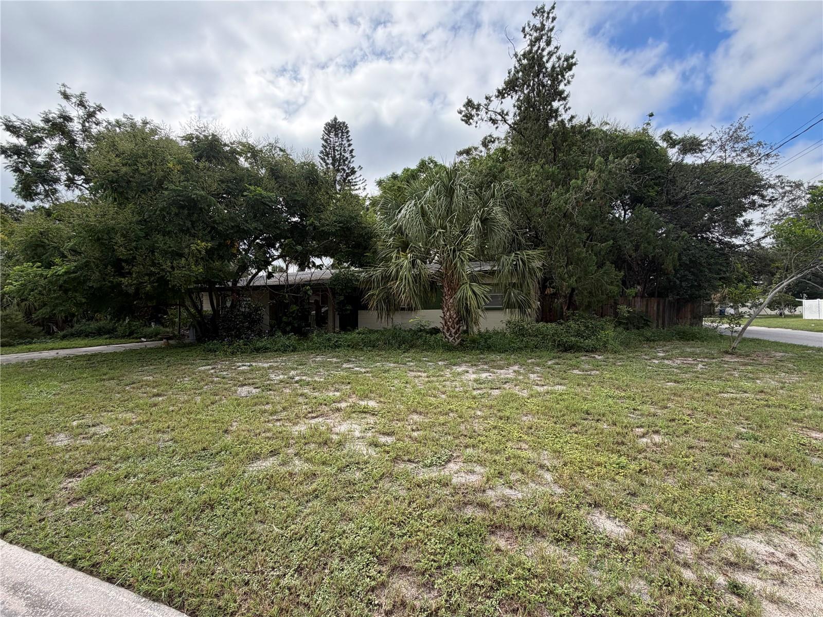 Opportunity knocks in South Tampa with this 3 bedroom, 2 bathroom block ranch home on a corner lot just minutes from MacDill Air Force Base. Built in 1958, the home offers 1,274 square feet of living space, original terrazzo floors, and a Florida room, but it will need a full renovation to reach its potential. Investors, builders, and buyers looking for a project will appreciate the flexibility here, whether you choose to restore the existing home or purchase for the land value.The 0.20 acre corner lot is partially fenced and sits in an established neighborhood with no HOA, giving you room to create exactly what you have in mind. The location is hard to beat, with quick access to the base, the Gandy Bridge, downtown Tampa, and the shopping, dining, and waterfront parks that make South Tampa so desirable. The property is zoned for Ballast Point Elementary, Monroe Middle, and Robinson High. Being sold as-is and currently vacant, this is a rare chance to secure a well-located South Tampa property and add value in one of the area's most sought-after markets.