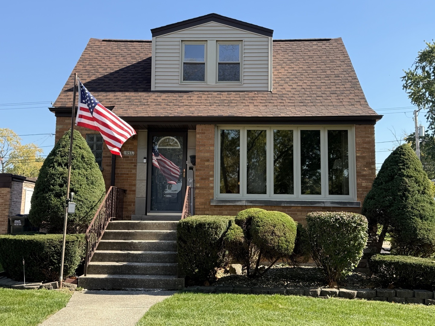 Great opportunity to own a charming brick Cape Cod in a highly desirable neighborhood! Offering 3 bedrooms and 2 full baths, this home features a spacious living room and beautifully refinished hardwood floors throughout the main and second levels. The kitchen offers granite countertops, a built-in double oven, cooktop, built-in buffet and table, and opens to a versatile space perfect for a dining room or family room. A main-floor bedroom and full bath add convenience and flexibility. Enjoy the sunroom overlooking the backyard and a brand-new deck ideal for outdoor entertaining. A concrete driveway leads to the detached 2-car garage. The basement offers additional living space with new carpeting, a separate flex room perfect for a home office, exercise room or hobbies, and a generous utility and storage area. Freshly painted throughout, this home has already seen many improvements, including a new roof in 2025, while still offering opportunities to add your own finishing touches. Furnace approximately 10 years old and water heater approximately 7 years old. With so much already done, plenty of flexible living space and a sought-after location, this home offers exceptional value for the price!