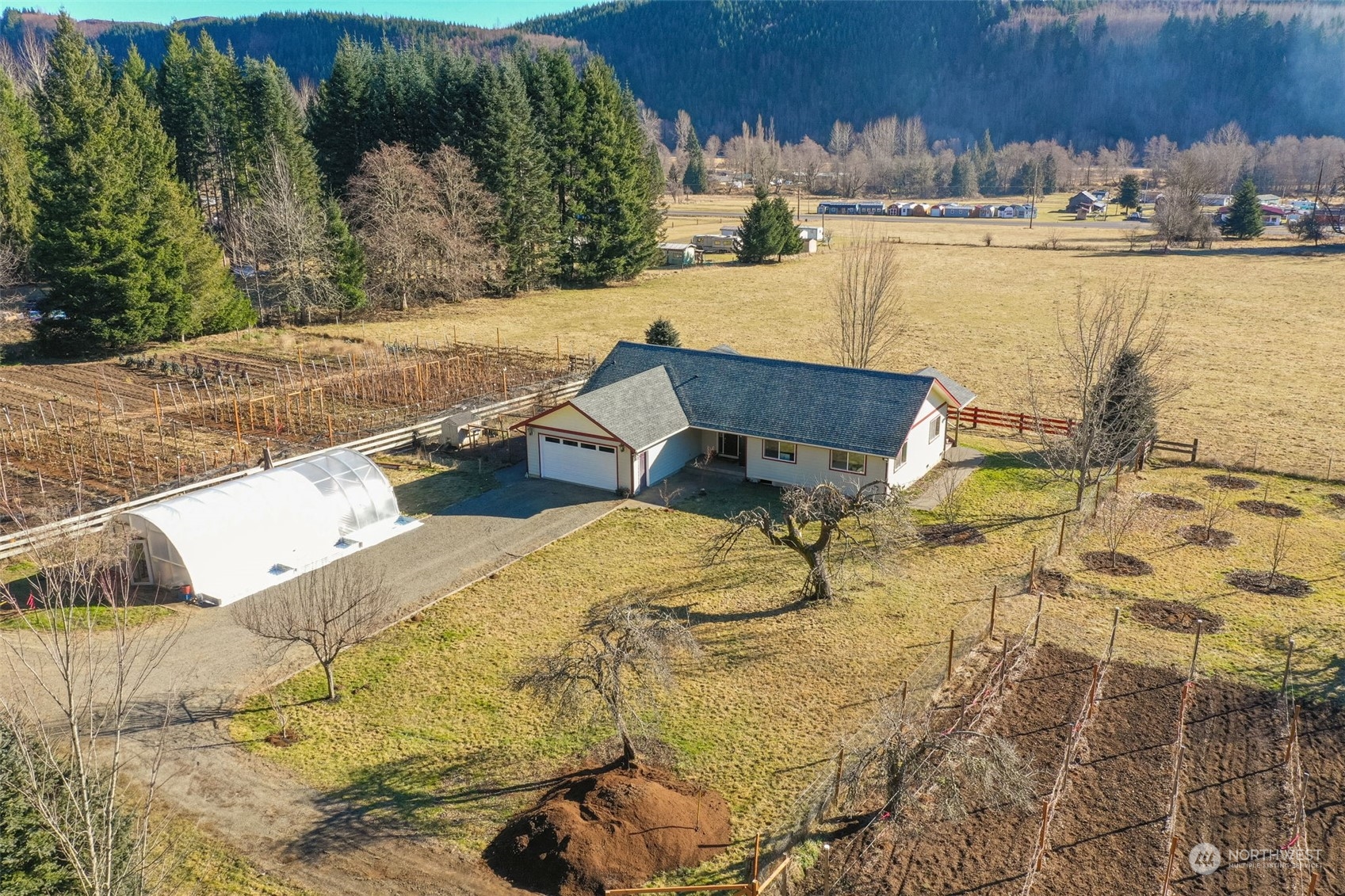 Nestled at the base of the stunning Cascade Mountains in Glenoma, this picturesque 3+acre working farm offers breathtaking panoramic views and a well-maintained, charming home—the perfect blend of rural tranquility and modern comfort. The profitable established farm, offers fantastic opportunity for homesteading, small-scale commercial gardening, or simply enjoying the beauty of open land. The home itself offers an open feel, newer appliances, and several upgrades throughout. With its prime location just between White Pass ski resort and I-5, yet just minutes to Mayfield lake, this property provides both seclusion and convenience. Don't miss this rare opportunity to own a slice of paradise where you can live, work, and thrive!