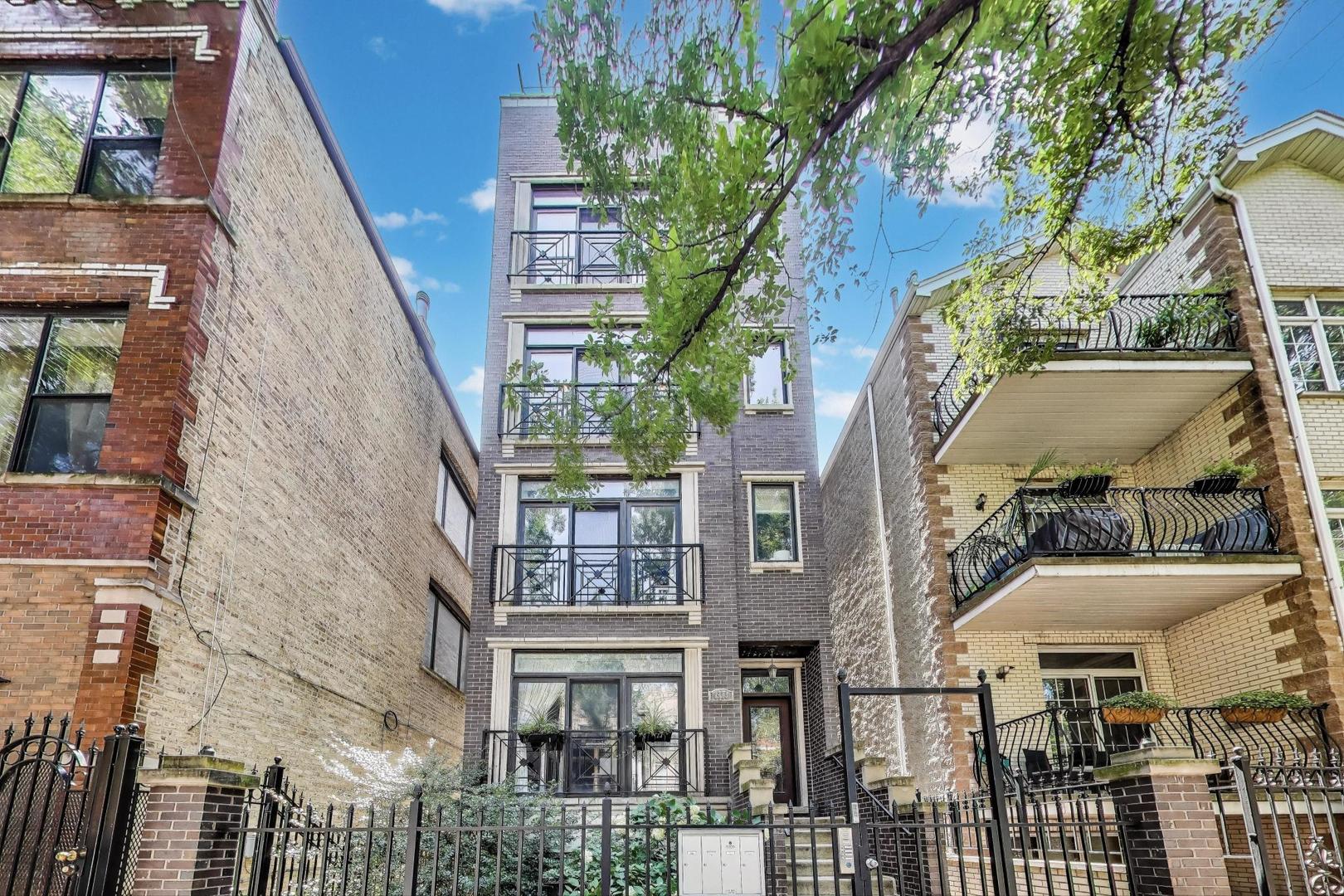 Bright and spacious 2-bed/2-bath layout in a well-maintained 3rd floor walk-up, perfectly situated on a tree-lined street in the heart of West Town/Wicker Park. Unbeatable location in one of the city's most vibrant districts, steps from Division Blue Line, easy 90/94 highway access, and the neighborhood's best dining, shopping, and nightlife around the corner.    The open layout features a large kitchen with island storage, tastefully updated cabinetry finishes, 1 1/4" granite countertops, and stainless steel appliances. A separate dining area connects seamlessly to the wide living room, with floor-to-ceiling windows bringing in plenty of natural light. Juliet balcony and a cozy wood-burning fireplace complete the space, making it perfect for relaxing or entertaining.    The primary suite offers direct access to a private 13' x 8' south-facing deck, a large walk-in closet with custom organizer, and a spa-like marble bath with dual-vanity, steam shower, and jacuzzi tub. The second bedroom provides flexibility for guests, a home office, a gym, and more!    Additional features include hardwood floors throughout, crown molding, side-by-side washer/dryer, central heat/air, generous closets, security system, and intercom. Gated parking and extra storage locker are included.