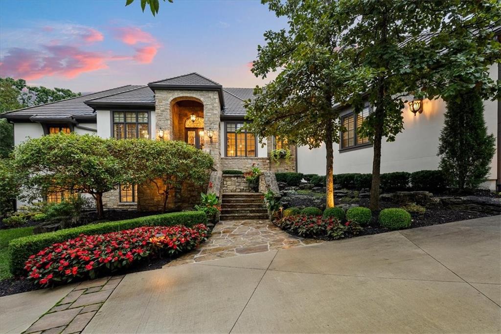 RARE opportunity to buy a gorgeous Reverse 1.5 with HUGE 3/4 acre walk-out lot on hole 17 in Loch Lloyd! Scott Bickford has designed an additional 2 car garage and POOL that fit on this lot for the next buyer. This house would cost 4 MILLION+ to reproduce but you won't be on the golf course or have complete PRIVACY and spectacular views like this home already has and is perfectly situated to enjoy the course and nature! The home has been meticulously maintained and remodeled with today’s updates including a new driveway, new lighting, oversized garage, remodeled Chef’s kitchen with top of the line appliances, large island, updated Master bath with heated floors, steam shower and the most unbelievable closet you have ever soon! Lower level has a huge bar for entertaining family and friends that includes an ice maker, refrigerated drawers, dishwasher and for the wine connoisseur, don't miss the 1,000 bottle temperature controlled wine room. 2 bedrooms are located on the lower level with ensuite baths and a 4th bedroom was converted to a huge master closet off the primary bedroom but can be converted back to a 4th bedroom. Home has multiple outdoor entertainment areas including an enclosed lanai accessible from the Master and Living Room, covered patio, outdoor built in grill and outdoor speakers. 130k in electronics, security, commercial generator, surround sound and cameras. New neighborhood amenities completed in 2025 including a brand new pool with swim up bar, pickleball, exercise facility and more!