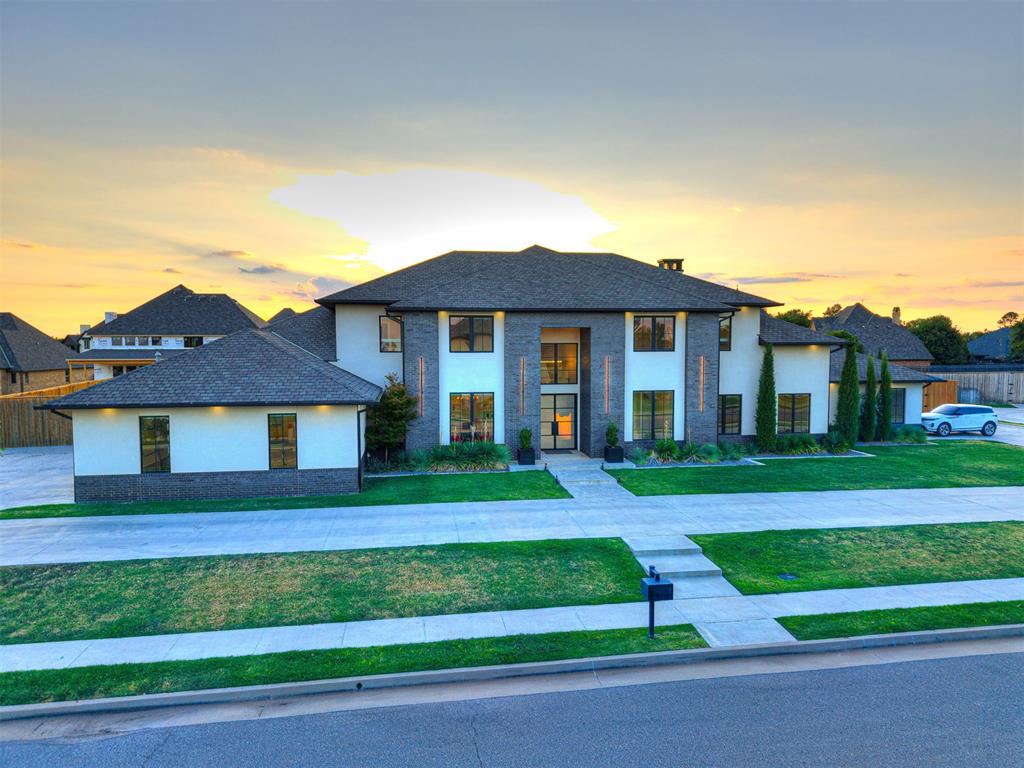 Tucked into the well-known Rivendell neighborhood in south Oklahoma City, this one-of-a-kind home offers modern elegance and the kind of escape from the everyday you've been craving, thoughtfully designed from the ground up with peace and relaxation in mind. Brought to life by builder Jim Bowers, whose craftsmanship is unmistakable throughout, this 6,978 square foot residence sits on just over half an acre and delivers a vacation-style energy that lasts far longer than any getaway. Mornings begin with coffee or tea on the remarkable covered back patio, overlooking a designer tiled pool and hot tub set against the soothing sound of a cascading waterfall, while evenings unfold in the chef's kitchen, complete with an oversized island and seating, a separate prep kitchen, and a glamorous wet bar for mixing cocktails without ever leaving the room.The home's notable features are as thoughtful as they are impressive, including high-efficiency geothermal energy, a stunning prayer room, a dedicated exercise room, a safe room, and an oversized four-car garage with abundant storage. Laundry rooms on both levels add everyday convenience, while a cozy reading nook and a spacious second-floor living room, complete with a mini fridge, ice maker, and sink, make entertaining effortless from top to bottom. Outside, the backyard oasis continues the experience with a remote-controlled screened porch and built-in heaters for year-round enjoyment, alongside a sleek gas fire pit for cooler evenings. Summer nights are made for the outdoor kitchen, paired beautifully with raised vegetable garden beds grown for fresh garnish straight from your own backyard.This is a masterpiece that is both modern and timeless, a home built not just to live in, but to experience.