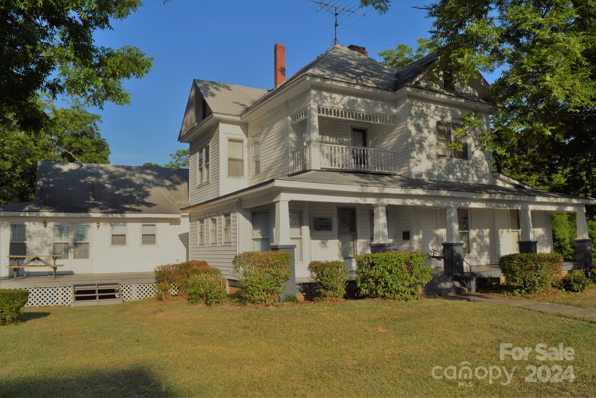 Historic Victorian Legacy Home Central NC Montgomery Co. 16 Rm Potential B&B or private home with live & workspace Original home built 1892 and 1910 w/2 wings built in 1980's. Move-In Ready. Min from beautiful Lake Tillery & Uwharrie Mtns with great recreational activities. 2 story antique paneled wood entrance, antique oak floors, stained glass window, massive staircase. Parlor w/fireplace, paneled library/office, pine bookcases. 10' & 12' stamped metal ceilings. Formal DR, birch paneling, antique mahogany over mantle fr/Mississippi River mansion, gas logs. Entertainment/Game rm, pool table. 6 BR, 3 1/2 BA. New microwave, double stainless sink, new DW, new double door stainless refrigerator, new stove. Paneled basement, rock fireplace, large wood stove, oak mantle. Additional lots available. New Trane HVAC. Composite Shingle Roof. Vinyl siding over wood siding. 6 New Vinyl Windows in DR. Storm windows, new storm doors. W/D. New Water Heater. Town water/sewer. Must see to appreciate!