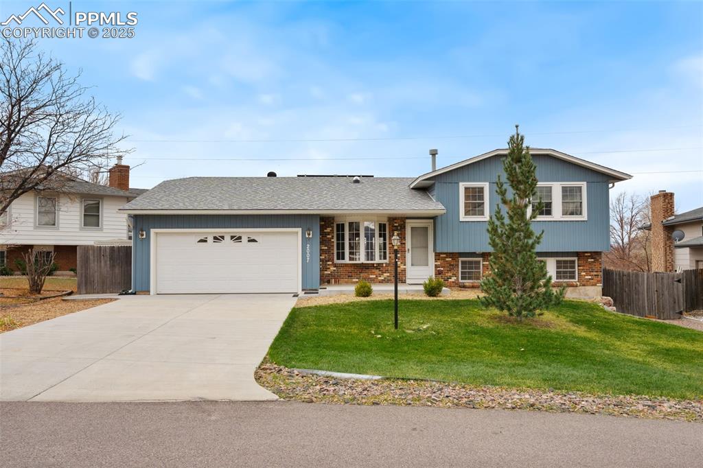 This Incredibly, beautifully updated, Briargate Tri-level home in D-20 features 4 bedrooms & an open floor plan. It boasts stunning views of Pikes Peak & the Front Range, with every window having a mountain view. It is situated on a quiet cul-de-sac & sits on nearly a quarter-acre fenced lot, with immaculate & attractive landscaping. The interior has been freshly painted in an elegant neutral color. The Main Level boasts gleaming Hardwood Floors, while the Bedrooms & Family Room have New Carpeting. Offering a perfect blend of style, comfort, & functionality, the open-concept Main Floor, featuring a Bay Window & a tubular Skylight, is bathed in natural light, creating a warm & inviting atmosphere throughout. The spacious Living Room flows effortlessly into the Dining Area & an amazing Kitchen. The Kitchen features an Atrium Window & a tubular Skylight, offering ample cabinet storage along with all appliances, including a brand-new GE Dishwasher. Adjoining Dining Area has double doors that lead out to the deck, making it perfect for relaxing and entertaining. The Tri-level floor plan provides separation & privacy for the 3 bright and cheerful Bedrooms, along with a full, previously remodeled 5-piece Bathroom on the upper level. The spacious Primary Bedroom features 2 large windows facing the mountains, built-in shelves, a double closet, & a door leading to the main bathroom. The stunning garden-level spacious Family Room, features built-in bookcases & a striking Brick Wall Wood Burning Fireplace. There is a delightful garden-level Bedroom off the family room, along with a Laundry Rm featuring a Washer & Dryer, as well as an adorable Bathroom. Laundry Room has an access door to a large crawl space area where the furnace replaced in 2019 is situated. The house features fully paid-off solar panels, central A/C, a sprinkler system, & an oversized 2-car garage with space for a workshop. Close to shopping, restaurants, I-25, & the Air Force Academy. A Must See Home!
