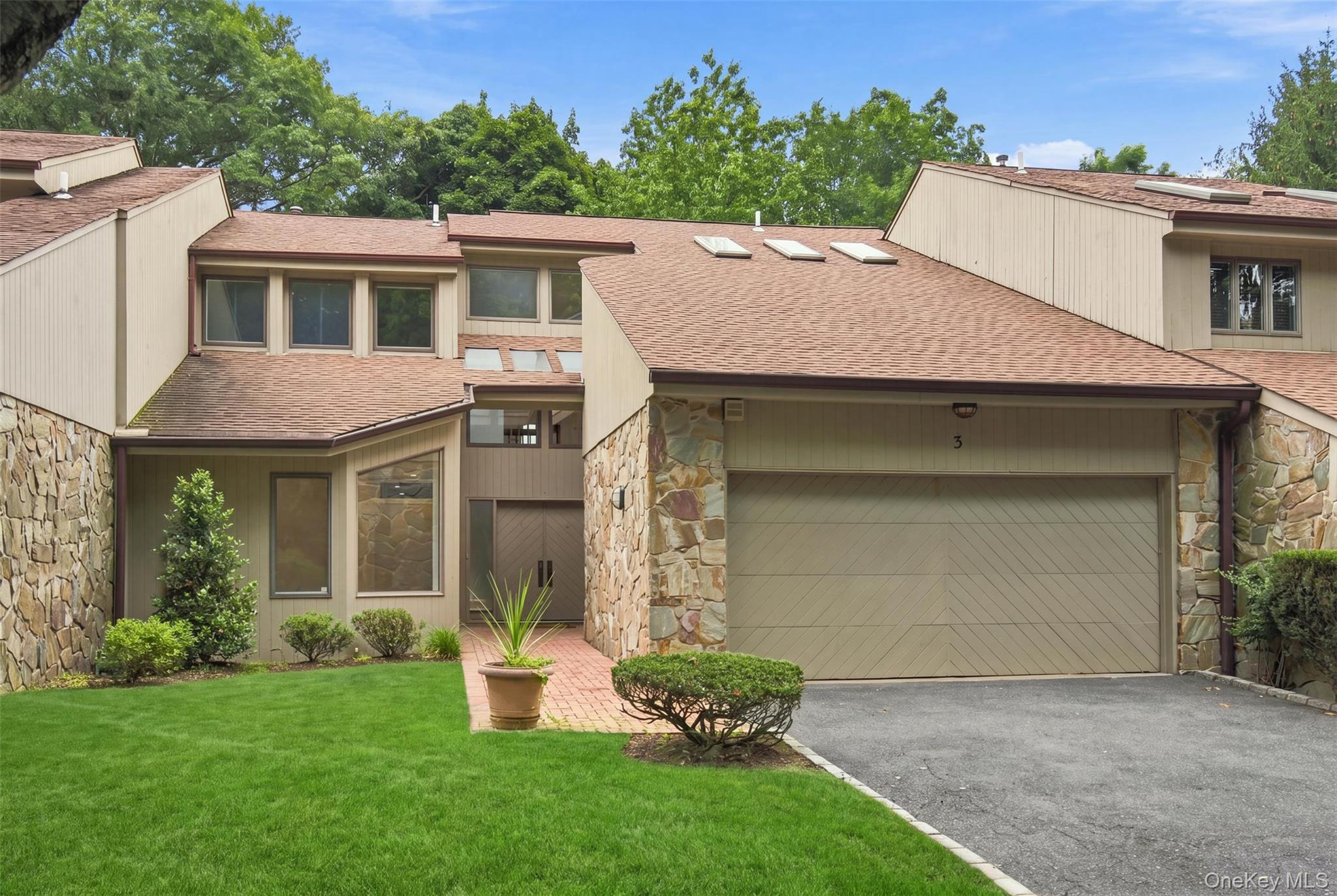 Welcome to an extraordinary, fully reconfigured residence nestled within the esteemed waterfront community of Cove Landing on the Sound in Glen Cove. Blending timeless design with effortless everyday living, this renovated 4 bedroom (primary suite on first level), 3.5 bathroom home offers tri-level living space in one of the North Shore’s most sought after communities.A dramatic two story foyer with soaring approximately 20 foot ceilings creates an unforgettable first impression, leading into a sun drenched open concept floor plan designed for both elegant entertaining and comfortable living. The formal living room has a beautiful fireplace and sliding glass doors which open to an oversized deck overlooking a tranquil, park like setting with seasonal views of the Long Island Sound. A spacious formal dining room provides the perfect setting for dinners and sophisticated entertaining. The newly designed kitchen is a true showpiece, featuring custom cabinetry, quartz countertops, and new stainless steel appliances, touch sensor faucet, perfectly designed for both everyday living and effortless entertaining. A first floor laundry room with washer and dryer and storage closet nadds convenience, while a luxurious first-floor primary suite offers the ease and convenience of main-level living, featuring an expansive dressing area, a spacious walk-in closet, and two additional closets for exceptional storage. The spa-inspired en-suite bathroom is complete with radiant heated floors and a free standing tub.The upper level offers two generously sized bedrooms, a full bath, and an expansive loft style living area overlooking the dramatic great room below and outdoors, creating the perfect setting for a  lounge, home office, or reading retreat. One of the bedrooms on the second level is a additional primary suite.The fully finished walk out lower level extends the home’s living space far beyond a traditional lower level. Featuring a spacious recreation area, an additional bedroom, a full bathroom, and direct access to a private patio, this incredible level offers endless possibilities for a home theater, game room, fitness studio, guest quarters, or multigenerational living. The property is equipped with a new security system.  Life at Cove Landing is about more than just the home, it’s about embracing a resort inspired waterfront lifestyle. Residents enjoy exclusive amenities including a swimming pool with furniture, changing rooms/bathrooms, new tennis and pickle ball courts, a shorefront clubhouse with storage for small boats, covered deck, private beach access, beautifully landscaped grounds, and peaceful waterfront seating areas where you can unwind while taking in breathtaking views of the Long Island Sound.Beyond the brick entrance, discover everything that makes Glen Cove one of the North Shore’s most vibrant and desirable waterfront destinations. Enjoy an exceptional selection of restaurants, cafes, boutiques, marinas, parks, golf courses, beaches, and year round community events, all just minutes from your doorstep. For commuters, the nearby Long Island Rail Road provides convenient access to Manhattan, making this the perfect blend of tranquil coastal living and city accessibility. Offering timeless elegance, impeccable craftsmanship, and an unparalleled lifestyle in one of Long Island’s premier waterfront communities, this move in ready residence is a rare opportunity to experience luxury living at its finest.