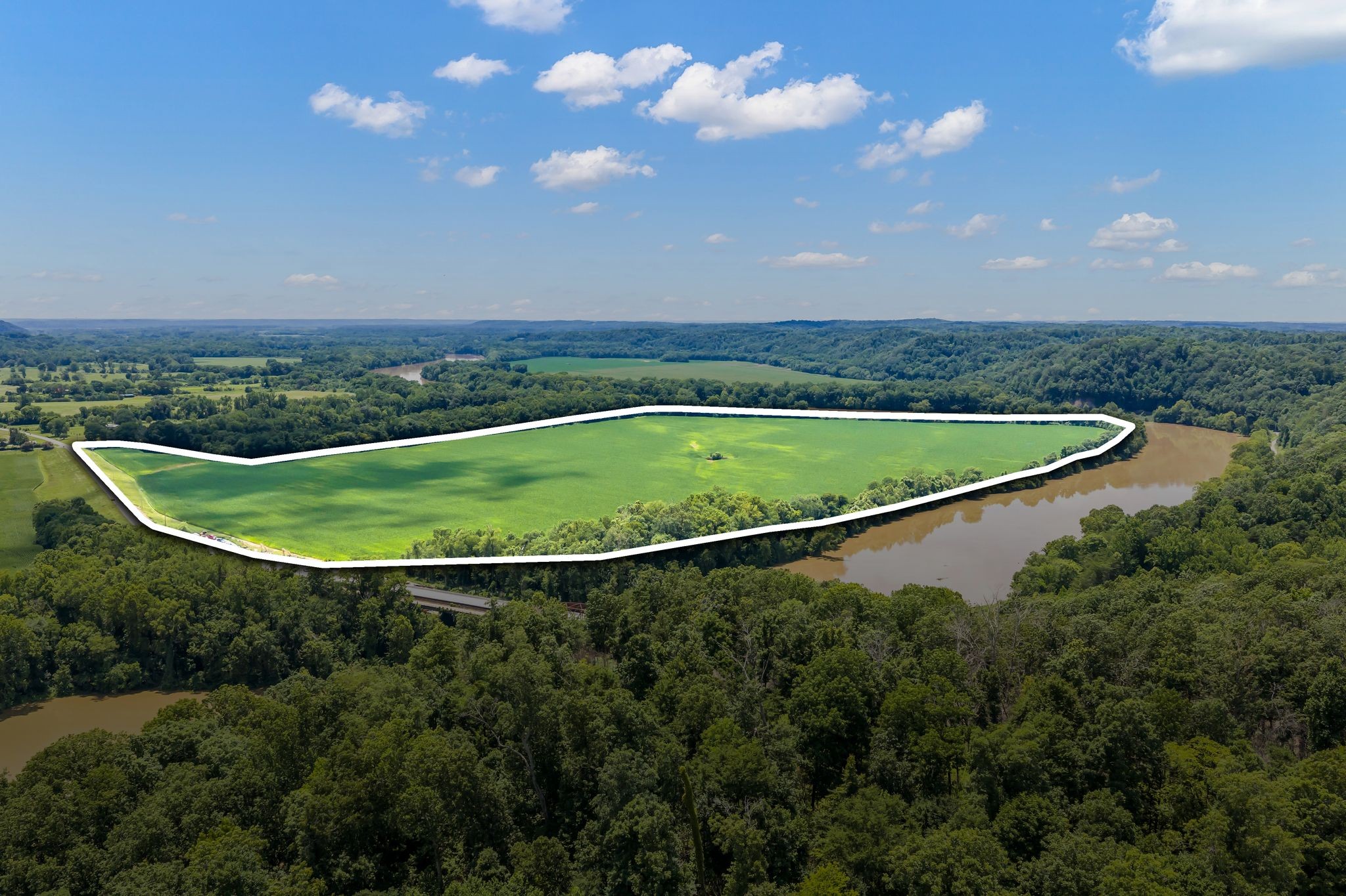 ONCE IN A LIFETIME CHANCE to own a premier location in the very center of proven Duck Hunting habitats! This approx.115 acre tract is in the Paint Rock bend of Duck River directly across from Paint Rock cliffs with River Frontage on two sides of the property! This tract has excellent access with electric, natural gas and internet available. The most attractive feature is LOCATION! It is literally surrounded by the most productive and proven waterfowl hunting clubs in Humphreys County directly in a major flyway! A look at maps with current hunting clubs will show any water fowler all they need to know. Highly productive Duck River bottom row crop ground at its finest ready for developing! Natural slew runs through this property!
