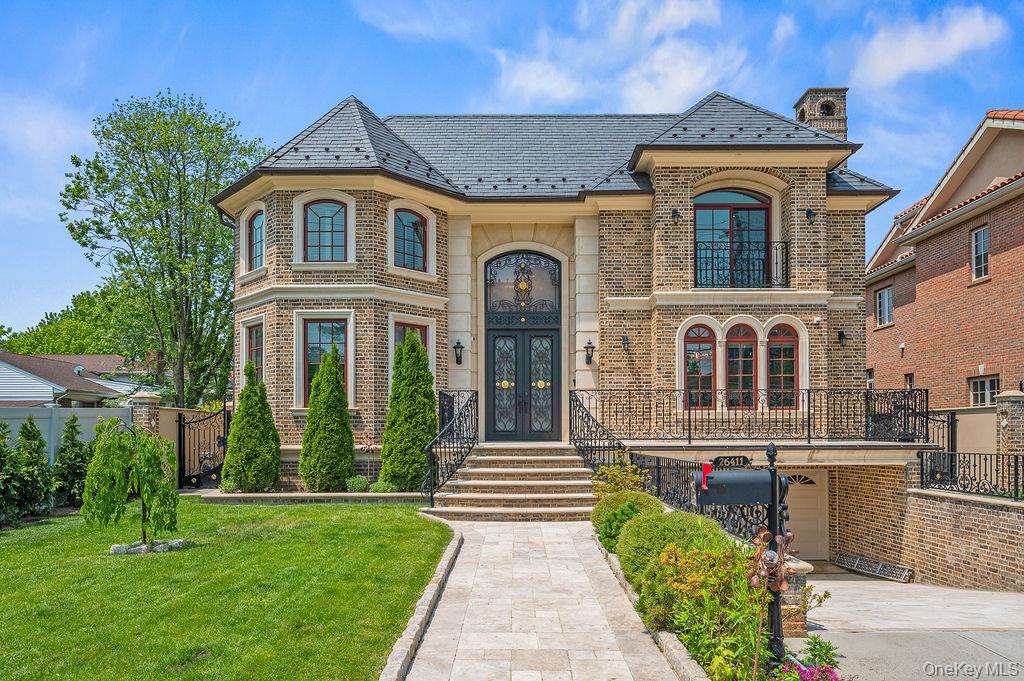 A High-End Custom Resort Style Modern Mansion in Little Neck. Welcome to an extraordinary custom mansion, built in 2016, in the prestigious Little Neck area, where architectural vision meets uncompromising luxury on an expansive 11,520 sq ft lot (60x198). This 5,640 sq ft masterpiece begins with a breathtaking 20-foot grand foyer that sets the tone for unparalleled craftsmanship throughout. The coffered ceiling living room and formal dining room create sophisticated entertaining spaces, with oversized windows flooding each room with natural light. At the heart of this resort-style sanctuary lies your crown jewel—a magnificent 400 sq ft climate-controlled indoor heated pool with humidifier, delivering year-round aquatic luxury. The culinary experience reaches new heights with a custom Cambridge kitchen showcasing premium Wolf and Sub-Zero appliances, complemented by a secondary service kitchen that ensures effortless entertaining for any occasion.Comfort is elevated to an art form through ten-zone radiant floor heating, eight-zone central air, and centralized fresh air circulation with 24-hour filtration throughout every corner of this architectural marvel. Indoor and outdoor living merge seamlessly through a stunning gazebo-style sunroom that opens to your lush backyard oasis, complete with a built-in DSC BBQ set for the ultimate alfresco dining experience. Exceptional craftsmanship reveals itself in every detail—from floor-to-ceiling stonework and rich engineered hardwood to the distinctive Welsh slate roof and elegant copper gutters. Your personal wellness retreat features an authentic Canadian cedar sauna, therapeutic soaking Jacuzzi tub, and a glass-enclosed double shower with commercial-grade Hansgrohe systems, creating a spa-inspired bathroom that rivals the world's finest resorts. Entertainment reaches cinematic heights in your dedicated 7-seat home theater, where leather recliners face a commanding 120-inch screen powered by 1,240 watts of premium audio-visual technology. The formal wine cellar satisfies the most distinguished connoisseur while enhancing daily living with sophisticated storage for your finest vintages. Thoughtful luxury extends throughout with an integrated 12-zone music system, central vacuum convenience, and dual laundry rooms for seamless daily living. The grand, curved staircase, adorned with bespoke iron railings, serves as a stunning architectural focal point, while energy efficiency is maximized through the use of spray foam insulation. Quaker windows and doors frame picturesque views while flooding interiors with natural beauty. The fully finished basement expands your living possibilities with an additional 1,800+ sq ft of entertainment space, while a two-car garage provides practical luxury. This architectural masterpiece transcends ordinary luxury living, creating a private resort where every carefully crafted detail serves both beauty and function—the ultimate expression of modern sophistication and refined comfort.