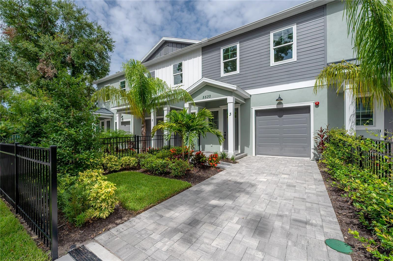 LIMITED-TIME BUILDER INCENTIVES — ACT NOW! For a limited time, buyers may receive up to $10,000 in closing cost credit PLUS the choice of one select interior or exterior upgrade—such as a screened-in patio, customized walk-in pantry/storage closet buildout, epoxy garage flooring coating, window treatments, ceiling fans, or other curated enhancements. Welcome to Seminole Landings Townhomes, a limited collection of brand-new construction thoughtfully introduced into one of Seminole Heights’ most established, walkable, and architecturally rich neighborhoods. Hampton Terrace is celebrated for its mature tree canopy, timeless character, and strong sense of community—along with its proximity to Lake Roberta, a beloved neighborhood landmark offering scenic water views, a walking path, and a peaceful gathering spot that reflects the area’s laid-back, community-oriented lifestyle. New construction in this setting is an exceptional and seldom-repeated opportunity. The open-concept first floor features high ceilings and energy-efficient LED lighting, creating a bright, refined living environment with seamless flow between the living, dining, and kitchen spaces. The chef-inspired kitchen is designed with both quality and function in mind, showcasing an oversized island, ceiling-height wood cabinetry with dovetail construction, granite countertops, stainless steel appliances, under-cabinet lighting, and a walk-in pantry—with optional customization available. Upstairs, a spacious loft offers flexible living space ideal for a media room, home office, or secondary lounge, while a centrally located laundry room adds everyday convenience. Tucked just off the oversized bonus/loft, two equally sized secondary bedrooms feature high ceilings, customized large closets, and large windows that keep the spaces bright and inviting—ideal for guests, family, or flexible work-from-home needs. The primary suite serves as a true retreat with soaring ceilings, abundant natural light, a custom walk-in closet, and a spa-like bath featuring a rainfall glass-enclosed shower, dual vanities, and elevated finishes. Each home includes a one-car garage, private fenced backyard, covered patio, paver walkways/driveway/patio, and premium landscaping, with the option to add a screened enclosure for enhanced outdoor living. Smart-home technology, hurricane-rated windows and doors, luxury vinyl flooring, energy-efficient systems, and LED lighting throughout deliver modern performance and peace of mind. LOW HOA dues. With a recent price adjustment, updated incentives, and limited inventory, Seminole Landings Townhomes represents one of the strongest new-construction values in Tampa’s urban core—set within a neighborhood where opportunities like this are rarely duplicated. Multiple homes are currently available, including a highly desirable end unit offered with lot-premium pricing. Availability and incentives are limited—schedule your private tour today. Incentives are subject to acceptable contract terms, availability, and may change without notice. Photos with furnishings are from the model home in the neighborhood with the same floorplan.