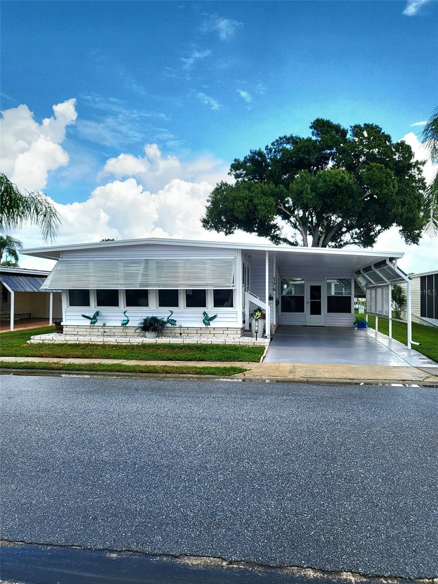 This stunning 2 bedroom, 2 bathroom home, is in one of the most sought after Resident Owned ( share included in price) golf course communities. Its floor plan has been lovingly updated boasting a newly renovated kitchen with all interior cabinets being completely refurbished, newer stainless steel appliances, high end quartz counter tops and under mount sink. Both bathrooms have been remodeled with high toilets, sinks and quartz counter tops. Filled with natural light, the kitchen plan flows easily into the dining and living room areas. AC was REPLACED in 2019, ROOF OVER REPLACED in 2019, VAPOR BARRIER REPLACED in 20025 along with NEW DUCT WORK and SEALANT applied to all exposed metal. 150 AMP service, copper wiring and. Double pane. Newer windows which are still under warranty.Enjoy your down time relaxing in the fresh air in the outdoor screened lanai, the rear patio or the enclosed Florida room.  Fairway Village is a spacious, premier manufactured home community. A perfect place to live your dream, Fairway Village is a spacious, premier resident-owned manufactured home community for residents 55 years and older. Located in sunny Largo on Florida’s beautiful Gulf Coast. Conveniently situated just 7 miles to the white sandy beaches, Clearwater's " Bay Care Sound " outdoor amphitheater, Largo Community Center, Library and Park as well as the renowned "Straz" Performing Arts Center. It offers a wonderful feeling of spaciousness, with wide, curbed streets, streetlights, and beautifully maintained surroundings. Residents enjoy a private 9-hole, par-3 golf course, featuring two lakefront fairways and a practice putting green. Outdoor amenities include a 5+ acre lake for catch-and-release fishing, two swimming pools with hot tubs, and eight sheltered shuffleboard courts. The impressive clubhouse, completed in January 2022, offers an exceptional variety of amenities and gathering spaces, including: 700-seat auditorium/ballroom, Large commercial kitchen, Stage for concerts and community programs, Conference rooms, Fitness center, Library, Billiard room, Card-playing room. Spacious lobby for relaxing, socializing, watching a game, or enjoying a good book 2026 Maintenance Fee – $420 per Month includes: Water and sewer, High-speed internet , 220+ Spectrum cable TV channels, Curbside trash pickup, Lawn care. Annual unlimited-play golf memberships are available to residents. Non-members may play for a $15 greens fee during the season and $8 during the off-season. The Fairway Village Social Committee (FSC) promotes and coordinates more than 50 social activities, providing residents with plenty of opportunities to meet neighbors, make friends, and enjoy the community. While the listing information is deemed reliable, please note, it is not guaranteed and should be independently verified for accuracy. Room sizes are estimates. Buyer and Buyer's Agent to verify dimensions. Do not submit offers via Dotloop.
