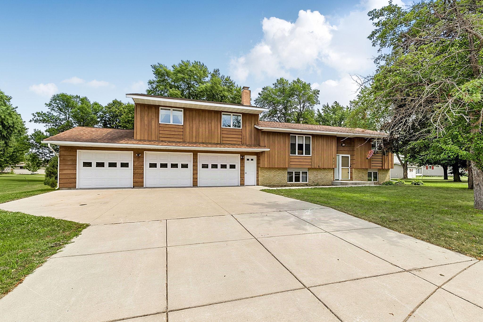 This is the home you have been waiting for! Located at the end of a quiet cul-de-sac on a large lot and just steps from the school, this move-in ready 5 bedroom, 3 bathroom home has room for everyone.  The main level features a spacious living room, a generous-sized kitchen that flows into the dining area, along with two bedrooms and a full bathroom. Just a few steps upstairs, you'll find a wonderful primary suite complete with a private ensuite bathroom.  The lower level offers two additional bedrooms and a comfortable family room with a wood-burning fireplace—perfect for relaxing or entertaining. The attached three-stall garage provides incredible space for vehicles, storage, or hobbies, while the new garden shed offers even more room for your outdoor equipment and tools. With its fantastic location, spacious layout, and move-in ready condition, this home is ready for its next owners to enjoy!