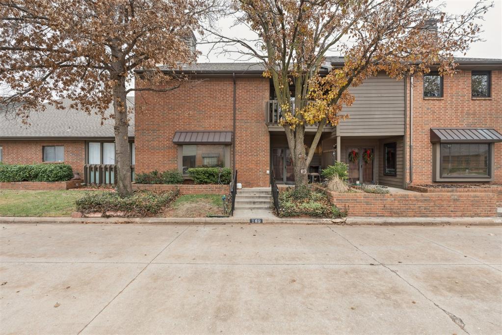 This beautifully designed home offers a spacious living area with custom built-ins and a cozy fireplace, perfect for relaxing or entertaining. A formal dining room features a wet bar with a wine cooler, adding an elegant touch for hosting guests.The lower level includes a bedroom with a full bathroom—ideal for a guest suite, in-law quarters, or a private study/den. The kitchen is a chef’s dream, boasting abundant cabinetry and countertop space, double ovens, and a built-in gas cooktop.Upstairs, you’ll find generously sized bedrooms, each with its own full bathroom and walk-in closet, including a cedar closet for extra storage. The laundry room is conveniently located on the upper level.Additional highlights include a rear-entry two-car garage, storm shelter, covered porch, and open patios for outdoor enjoyment. Residents can also take advantage of the neighborhood pool and tennis courts.The HOA provides exceptional value by covering exterior maintenance, roof, water, trash, and lawn care—making for easy, low-maintenance living.