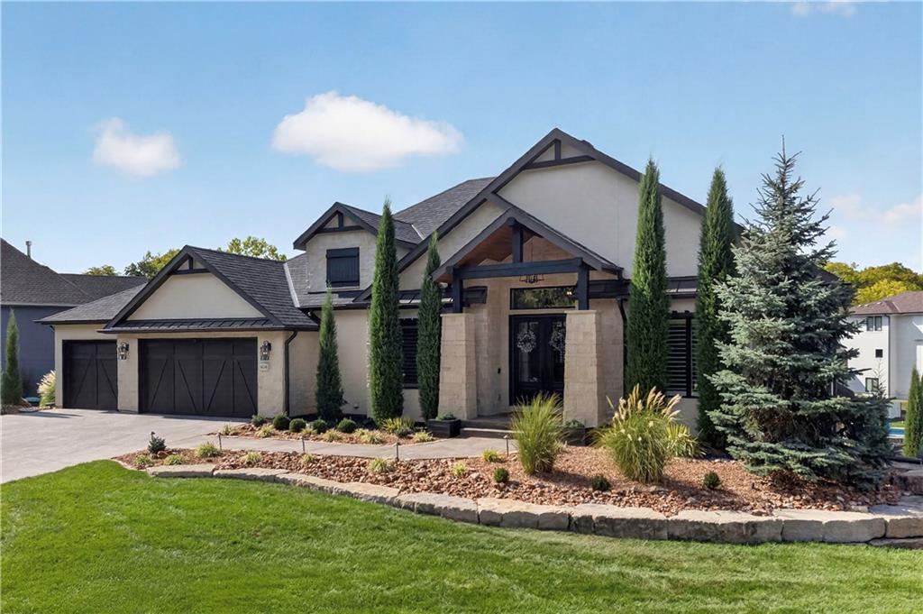 Nearly 6,000 sq ft of luxury lake living awaits at this incredible Lake Winnebago estate. Meticulously maintained and lightly used as a second home, this is the kind of place where weekends turn into traditions and friends and family never want to leave.The open main level was made for entertaining, with vaulted ceilings, custom wood beams and a wall of windows showcasing the lake. The kitchen features granite countertops, built-in refrigerator, gas cooktop and floor-to-ceiling cabinetry, plus a walk-through prep kitchen with a second oven, dishwasher, beverage cooler and incredible storage. Two screened porches give you the perfect places to grill, gather around the outdoor fireplace or simply enjoy the lake.The main-level primary suite is its own retreat, complete with a sitting room and fireplace overlooking the water. The spa-like bath features a massive tiled shower with body sprayers, soaking tub and oversized walk-in closet with custom built-ins, makeup vanity and private laundry.Downstairs doesn't feel like a basement. A 12' foundation creates an impressive lower level featuring a stone fireplace, wet bar with island, glass-enclosed wine room, theater with stadium seating and four additional bedrooms—including a custom bunk room made for weekend guests.Step outside and the vacation really begins. A gunite pool with waterfalls and oversized hot tub overlook the lake, while the stone outdoor kitchen, pool bath and sunken outdoor fireplace create your own private resort. Just steps away, your private dock is ready with a boat lift, two jet ski lifts and dock boxes.Across the street, greenspace and walking trails add even more to the setting. With minimal traffic in this part of the lake, it's a perfect spot for a morning walk, bike ride or evening stroll.Hardwood floors throughout, heated 3-car garage, three laundry areas, plantation shutters, class 4 roof, and countless other upgrades.Come for the weekends. Stay for the memories.