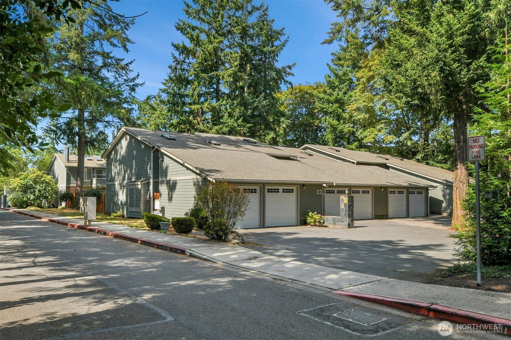 A spacious and private end unit, upstairs in the small, well-maintained Highland Lane Condominium complex. Tucked away from busy streets and just past the new Loft Condominiums, this home provides you the peace and quiet you want while still offering restaurants, groceries, health care, movies, the farmers market – all the vibrant life of 156th and Crossroads Mall – within easy walking distance! Unit D24 has 2 bedrooms and 2 bathrooms, features vaulted ceilings, skylights, and a quiet balcony to watch the sunset from. Originally built in 1975, Highland Lane condos were completely renovated in 2008, w/many upgrades since then. Slate fireplace w/custom built-in bookcases, gourmet kitchen, stainless steel appliances, comfortable A/C. Large storage closet is accessed right from your balcony, and your private garage downstairs has plenty of storage space as well. Walking distance to everything at Crossroads Mall, and less than a mile from Bellevue Marketplace. Easy commute to all over! It's on the B-line and Route 224, as well as just a 25 minute walk to the light rail station. Come see for yourself!