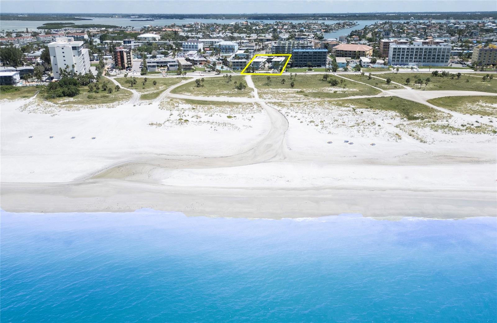 CALLING ALL BEACH LOVERS! YES, CALLING ALL BEACH LOVERS!  BRAND NEW ON THE MARKET!  WELCOME TO THE BEACH!  Wait till you see this DIRECT BEACHFRONT updated renovated RESORT with a BRAND NEW POOL completed mere weeks ago, offering you this fantastic opportunity!  What a great value, priced to sell quickly and easily!  You'll love the MODERN NEUTRAL EXPENSIVE upgrades #9 unit offers, capable of bringing in the highest rental potential with THESE BRAND NEW UPGRADES JUST COMPLETED, (DOCUMENTS/REPORTS/INSPECTIONS INCLUDED for your easy review). BEAUTIFUL DURABLE FLOORING perfect for the beach, EXPENSIVE COMFORTABLE KING BED, GORGEOUS FULL STAINLESS STEEL KITCHEN even offering a FULL STOVETOP AND OVEN -- for a STUDIO!  Your own beachfront parking space, your own private owners storage locker area for beach toys & beach bikes, RENOVATED OWNER'S LOUNGE, so much more!  

Located on world renowned beautiful pristine expansive Treasure Island Beach, which again, was recently voted by the public in a recent *USA TODAY 10 BEST READERS' CHOICE AWARDS* and this time was voted as one of the TOP 3 BEACHES IN FLORIDA!*  3rd after Clearwater Beach!  Wow, Impressive!  And with an esteemed address of *Gulf Boulevard* Tropic Terrace Condo Hotel is a DIRECT BEACHFRONT RESORT on the quiet coastal community of Treasure Island. "TI"  as the locals like to call it, is nestled quietly between larger, busier Clearwater Beach and busy St Pete Beach.  Here at the completely remodeled vintage hotel resort community of Tropic Terrace, remodeled after Helene, this utterly relaxing, perfectly remodeled studio style hotel room (with a MODERN FRESH HOTEL VIBE FEEL) #9 Condo features a true fully furnished fresh bright exceptionally clean condo, located easily on the ground floor, in the renovated mid-century modern boutique hotel, circa 1950 and upon seeing Tropic Terrace, will bring you back in time and delight you, not only with it's renovations but moreso with it's great list price and opportunity!   You won't find a turnkey fully renovated MODERN TOES IN THE SAND beachfront treasure like this for this price!   

Exceptional POOLFRONT Condo #9 along with tropical Tropic Terrace gives you everything on your checklist.  Your weekends will definitely feel more relaxing, with bright sunshine, palm trees, beautiful aqua waters, toes in the sand beach days, while enjoying a cool swim in TT's BRAND NEW POOL (just opened), along with evenings of happy hours and dinners, dining alfresco at popular TI restaurants, enjoying postcard-like sunsets -- your weekends never looked better with Tropic Terrace's NEWLY REMODELED MODERN HOTEL VIBE #9 as your new turn key Oasis beach getaway when you invest in your very own beachfront sanctuary that is so affordable, you'll be wanting to see it immediately!  Call NOW for your tour of this amazing tropical property and great fully furnished unit 9 -- ready for IMMEDIATE OCCUPANCY either as owner or rent out for guests via the on-site prop. mgmt rental company great ROI's!  According to previous profit & loss rental reports, this should cover your yearly expenses, HOA, taxes, etc.  And with a HOA that generously covers everything - ELECTRICITY, yes, includes electricity along with water, sewer, trash/garbage, cable tv, wifi, parking spot, owners lounge, pool maintenance, insurance, lawncare/landscaping, pest control, on site rental mgr, etc.  (you only pay property taxes).  CALL TODAY-COME TO THE BEACH.  EASY SHOW!