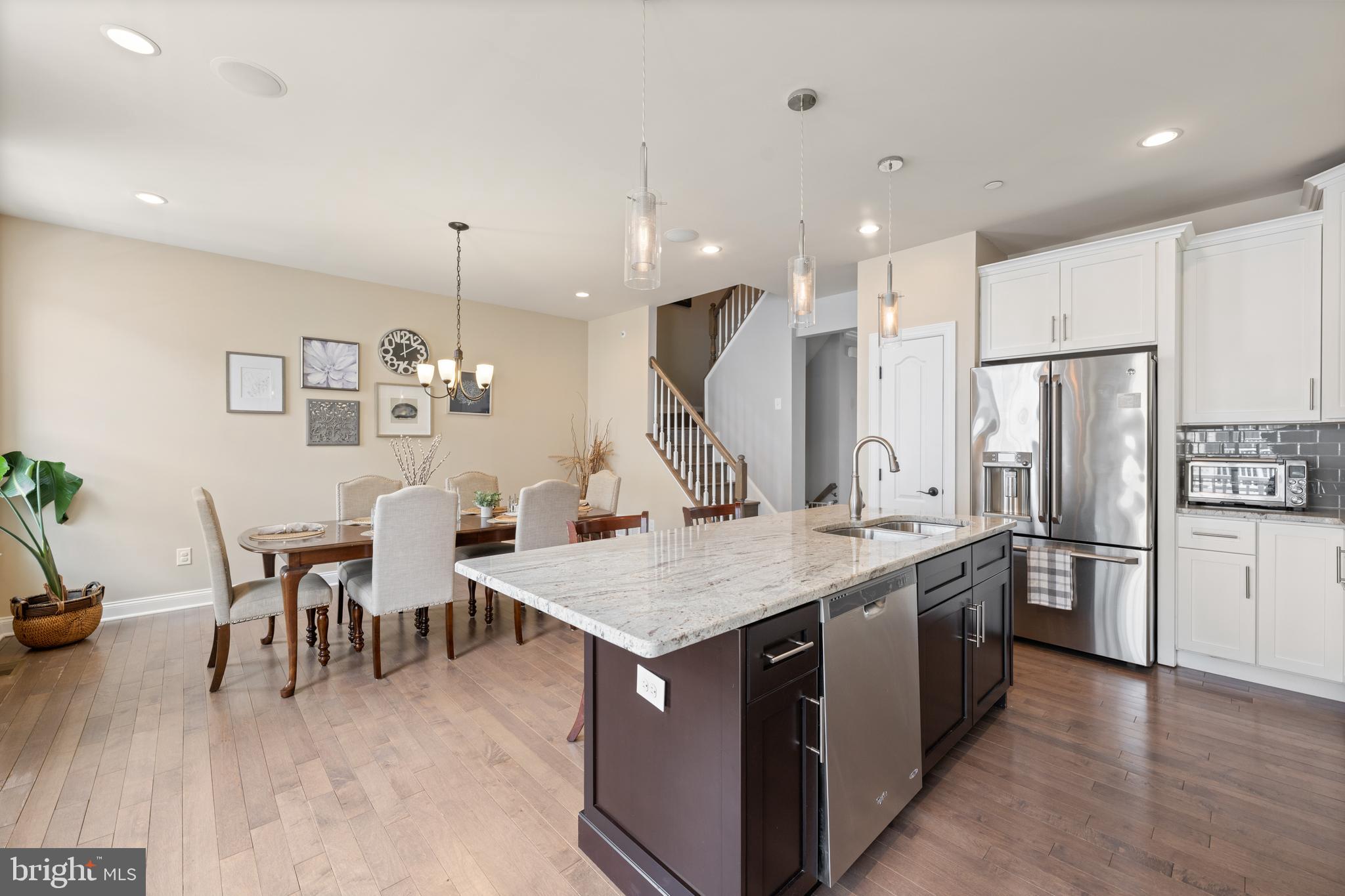 Looking for a carefree lifestyle close to the vibrant town of Media? Don't miss this beautiful 3-bedroom, 2.5-bath townhome offers an open, sun-filled floor plan with 9-foot ceilings, hardwood floors, and oversized windows throughout the main level. Enter into the welcoming foyer with a flex space that can be used as an office, bedroom or media room. The attached 2 car garage is also located on this level. The main floor includes the chef’s kitchen featuring a large island with a double sink, upgraded granite countertops, beveled subway tile backsplash, white soft-close cabinetry, under-cabinet lighting, and a spacious breakfast area. The kitchen opens seamlessly to both the family room and dining area, with sliders leading to a low-maintenance composite deck—perfect for relaxing or grilling. Upstairs, the primary suite features a tray ceiling, walk-in closet, additional slider closet, and a beautifully appointed bath with a double vanity and an oversized custom walk-in shower with bench seat. Two spacious secondary bedrooms, a hall bath with tub/shower combo, and a convenient second floor laundry area with full-size washer and dryer complete the upper level. Ideally located just minutes from historic downtown Media’s boutiques, dining, entertainment, and "Dining Under the Stars." Ravenscliff also offers easy access to I-476, Route 1, a short drive to the Philadelphia International Airport and the SEPTA train to Center City Phila has a stop in Media.