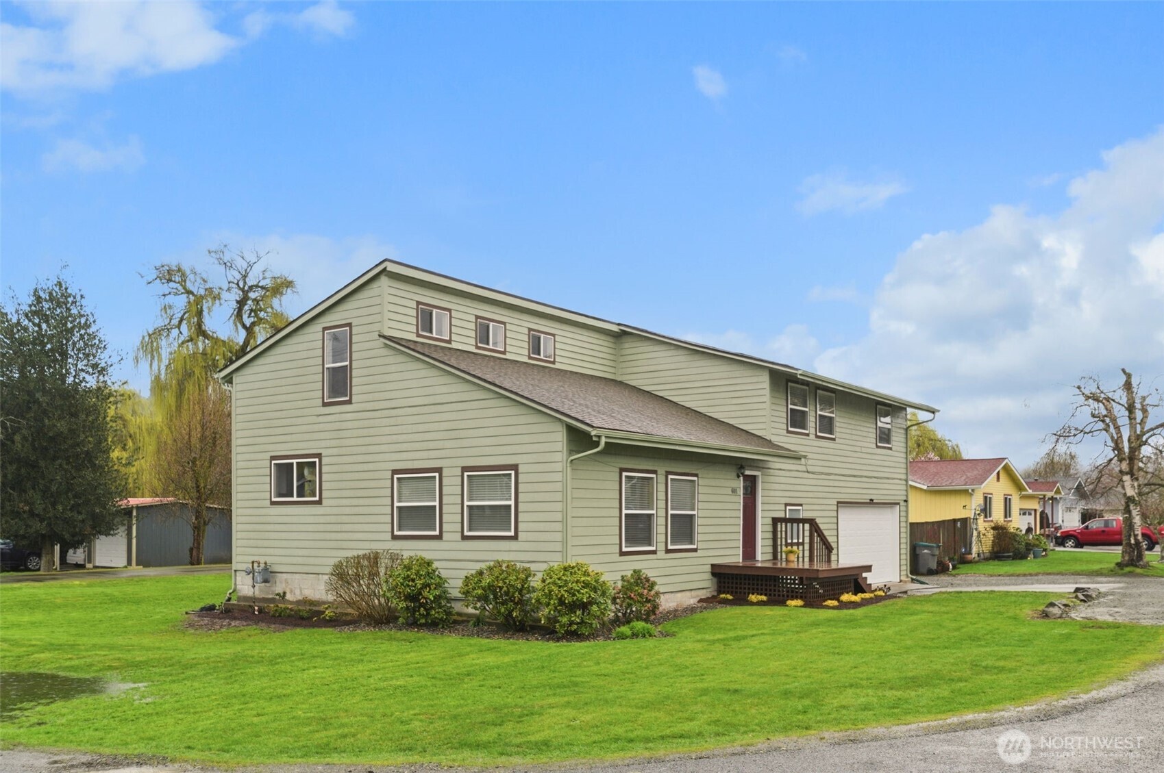 Located in the quiet community of Algona, this beautifully updated mid-Century home sparkles. Situated on a large corner lot, complete with RV parking and hookups, it is a commuter’s dream with easy access to Hwys 167, 18 and I-5. Inside is light and bright with brand new luxury laminate flooring throughout and a completely remodeled kitchen. The gorgeous quartz counters are highlighted by stainless steel appliances and custom lighting. Upstairs the large primary suite flows seamlessly to the gorgeous remodeled ¾ primary bath. Two large additional bedrooms upstairs AND an oversized bonus room that can also be used as a bedroom. The oversized 2-car garage has room for everything as does the custom-built outbuilding. Large deck is perfect for entertaining as it overlooks the peaceful backyard. Complete with a newer high-efficiency furnace, tankless water-heater, central AC, AND a new foundation (transferable warranty included). This home is a must see!