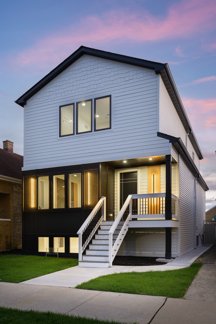 Exquisite, Fully Renovated 4-Bedroom Home in Jefferson Park. Nestled on an extra-wide 30' x 120.9' lot, this stunning 4-bedroom, 3.5-bath single-family residence blends timeless design with modern luxury. Thoughtfully crafted from top to bottom, the home offers exceptional space and sophisticated finishes throughout.  The sun-filled main level boasts a gracious open-concept layout, highlighted by a central chef's kitchen featuring custom cabinetry, stainless steel appliances, quartz countertops and backsplash, an oversized island, a walk-in pantry, and a stylish powder room. A custom-built mudroom leads to a spacious rear deck overlooking a fully gated backyard with a grassy area between the garage and deck-ideal for relaxing or entertaining. A brand-new detached 2-car garage, complete with an EV charger outlet, completes the outdoor setting. Upstairs, the serene primary suite showcases a spa-inspired en-suite bath and a walk-in closet with custom organizers. Two additional bedrooms also offer generous walk-in closets with built-ins and share a full bath with a tub/shower combo. A convenient second-floor laundry room includes a smart washer and dryer. The finished lower level is designed for comfort and entertainment, featuring a bedroom, full bathroom, large recreation room with a dry bar. Additional highlights and upgrades include: Ring doorbell for added security, Nest thermostats with zoned HVAC systems, USB charging outlets throughout the home and in all bedrooms Pre-wired for cameras outside, Built-in speakers throughout, Pre-wired for Ethernet connectivity, Pre-wiring for a 5.1surround sound system in living room perfect for a home theater setup, Smart appliances, including stove, microwave, and dishwasher, Dimmers in bedrooms and main living areas for customizable lighting, New copper water line (no lead pipes) for peace of mind. Ideally located just minutes from the Forest Glen Metra station and public transportation, this home offers the perfect blend of tranquility and city convenience. Don't miss this rare opportunity to own a totally renovated, impeccably designed home in one of Jefferson Park's most desirable locations.