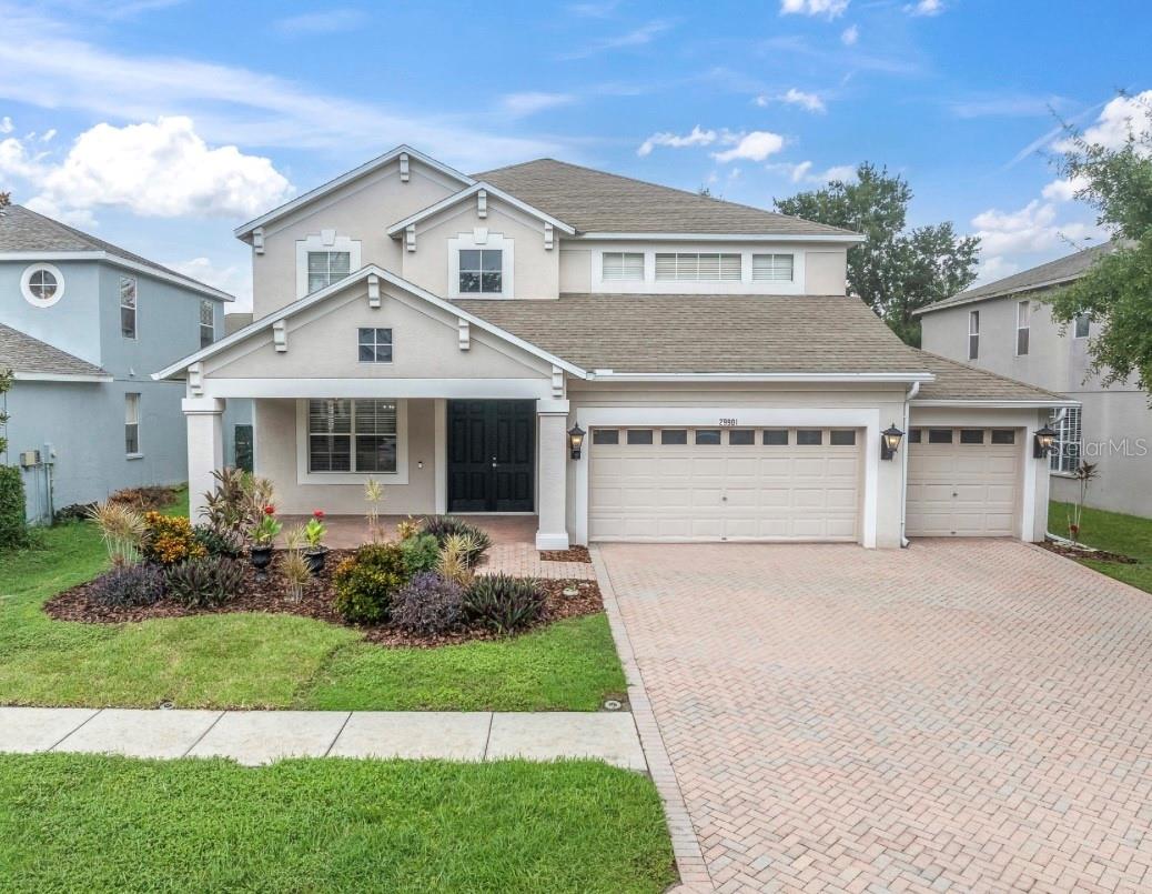 Discover your dream home in this elegant two-story residence, nestled in a small, peaceful community of Boyette Oaks. This home offers the perfect blend of luxury and comfort.  Boasting a 3-car garage and a beautiful paver driveway, this home invites you in with a welcoming front porch, an ideal spot to sip your morning coffee.  Step inside to soaring high ceilings that create an open atmosphere. The entire interior has been FRESHLY PAINTED THROUGHOUT with a warm, neutral beige.  Stunning ceramic tile flooring with the elegant look of hardwood.  The main level features an open floor plan with formal living and dining area, perfect for entertaining guests, alongside a cozy family room that overlooks the expansive screened lanai.  To enjoy the fantastic, 600 square feet lanai, you can simply open up the triple sliding glass pocket door, making it perfect for entertaining with lots of room for seating, BBQ and even a hot tub- it's your own private oasis with so much space. The landscaped backyard is fully fenced with lots of room for the kiddo's & doggies to play.  As you head back inside, the heart of the home is the amazing gourmet kitchen, equipped with stainless steel appliances, NEW side by side refrigerator, a cooking island, granite countertops, real wood cabinetry, walk-in pantry, breakfast bar and a dinette nook for those casual meals.  A handy half bath is located downstairs, giving easy access for your guests and perfect access to the back patio as well.  There's also a generous sized laundry room with storage cabinets, front-loading washer & dryer plus a laundry tub.  As we venture upstairs, you'll find a versatile bonus room, giving you space for a home office, game room, home gym or a cozy lounge area-so many possibilities.  The bonus room also gives you access to the covered 2nd story terrace that overlooks the pretty backyard.  Your grand master suite awaits, tucked away down a few steps for added privacy, this expansive bedroom & master bath together offers you a private oasis of your own.  With his/her vanities, his/her walk-in closets, separate walk-in shower & relaxing garden tub you'll feel like you're at a private spa.  The secondary bedrooms will not disappoint, one with a walk-in closet and a nice size bathroom in between them with lots of counter space.   If all of this isn't enough, the big-ticket items are taken care of for your peace of mind; THE NEW ROOF is scheduled to be done in September and comes with a 10-year labor warranty included for the new buyer!  The new AC was installed in 2020.  Some additional features include, ceiling fans, even on the porch & screened lanai, easy to maintain ceramic tile throughout the downstairs, lots of storage closets, Ring doorbell & home security system.  It's such a rare find to have three separate outdoor spaces, be prepared to fall in love!  And the three-car garage has so much room for your cars & lots of extra storage or even a workshop area.   Boyette Oaks is a well-maintained community with low HOA fee of $350 twice a year, sidewalks for nice evening strolls & pet areas for the fur babies.  Convenient location with easy access to I-75, close to some of the best shopping & dining in the area and within walking distance to the Boyette Family Farmers Market for your fresh fruits & vegetables, local honey & homemade treats.  This gorgeous home has so much to offer- it won't last long, give me a call for your private showing today.