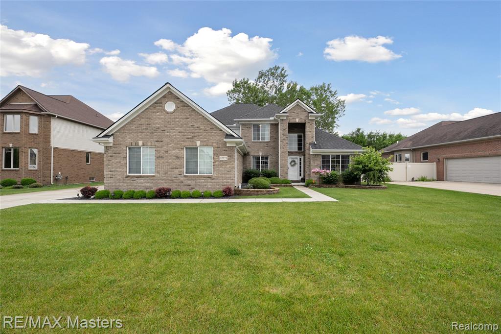 Welcome Home to 32723 Adam Brown Drive!!  This beautifully maintained home features 5 BEDROOMS and 3.5 Baths including ONE FULL BATH ON EVERY FLOOR! Main floor Primary Bedroom allows for plenty of privacy and features one of the large full baths, as well as 2 walk-in closets!  The vaulted ceilings and windows in the living room allow for plenty of light, but if things get too bright, just close the powered shades with your remote!  The massive kitchen features extra long granite countertops, plenty of cabinet space and double sink.  HARDWOOD FLOORS throughout the main floor living room, kitchen and dining area.  The formal dining room with French Door is currently an office, but you can move out the desk, bring back the table and enjoy your meals morning, noon and night!  The upstairs features 3 more bedrooms and a large full bath.  Each bedroom has its own walk-in closet!  If that's not enough, the basement has already been finished with Coreluxe 5mm vinyl plank flooring and granite countertop bar area - and the wine fridge stays!  Basement also features your 5th bedroom w/egress window and 3rd full bath!  Still plenty of storage and a Bilco basement door allows for another access point for ease to move things in and out of the basement.  Backyard features patio and lovely gazebo.  3 car garage has room for everything. So much to see and so much to offer. Schedule your appointment today and come see for yourself!