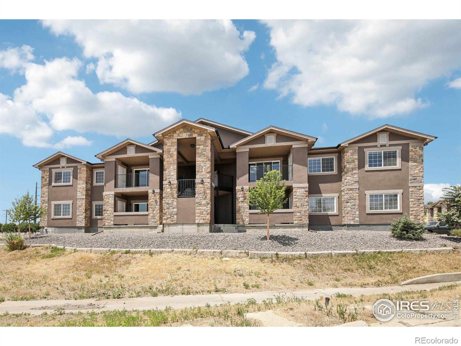Seller is offering a $12,000 CONCESSION that the Buyer can use towards CLOSING COSTS or a RATE BUYDOWN. Be the first to enjoy this BRAND-NEW condo, the LAST main-floor unit available in this building! Experience effortless living in a prime Denver location with modern finishes and easy accessibility. Designed to accommodate a lock-and-leave lifestyle, this residence allows you to enjoy both peace of mind and the freedom to explore everything the city has to offer. As you step inside, the open-concept layout greets you with a welcoming sense of space, highlighted by low-maintenance wood laminate flooring that eases daily upkeep. A stylish gas fireplace serves as the focal point in the living room, providing a cozy setting for relaxation or entertaining. Get creative in the spacious kitchen, where elegant marble countertops complement the stainless steel appliances, all included to ensure a seamless move-in experience. Serenity extends to all three bedrooms, each carpeted for comfort and warmth, with the primary suite expanding into a larger space that includes an ensuite bathroom and a walk-in closet. The covered patio offers a perfect spot for sipping your morning coffee or relaxing in the fresh air, complete with a convenient storage closet for your extra belongings. Ample parking ensures easy access for both you and your guests. Positioned near Denver, DIA, and the Metro area, this condo places you at the heart of Colorado's best, with close proximity to city amenities, transport links, and a spectrum of cultural and recreational activities. Discover your new lifestyle in this vibrant setting, where comfort meets convenience. Rentals with a minimum duration of 30 days are permitted. There are multiple new units available in the building. See MLS #1036834 for a top floor model. For all scheduled open houses, please visit the model unit #71.