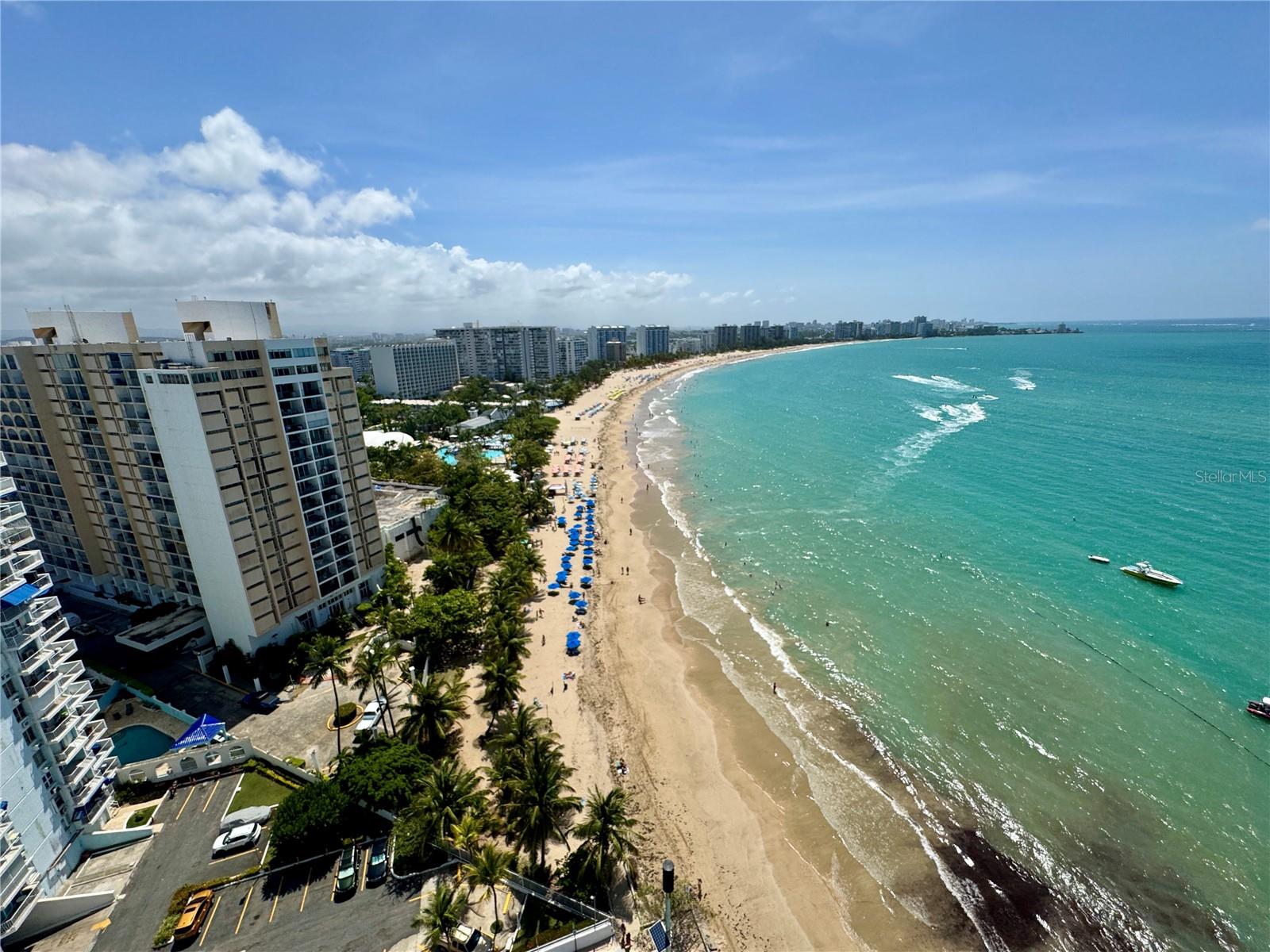 High-floor beachfront apartment in Playamar, Isla Verde, with breathtaking ocean views and a glass-railing balcony to enjoy the breeze, waves, and sunsets. Features an open kitchen/living area, 2 bedrooms, 1 bathroom, and 1-car parking. Exclusive building with only 3 units on each floor, rooftop pool and terrace, elevators, a generator for common areas, and 24/7 security. Prime location just minutes from Luis Muñoz Marín International Airport and Old San Juan. Situated within the Isla Verde Marine Reserve, voted one of Puerto Rico’s best beaches, with direct beach access and nearby luxury hotels, restaurants, nightlife, and upscale residences. Perfect as a full-time home, vacation retreat, or investment opportunity.
