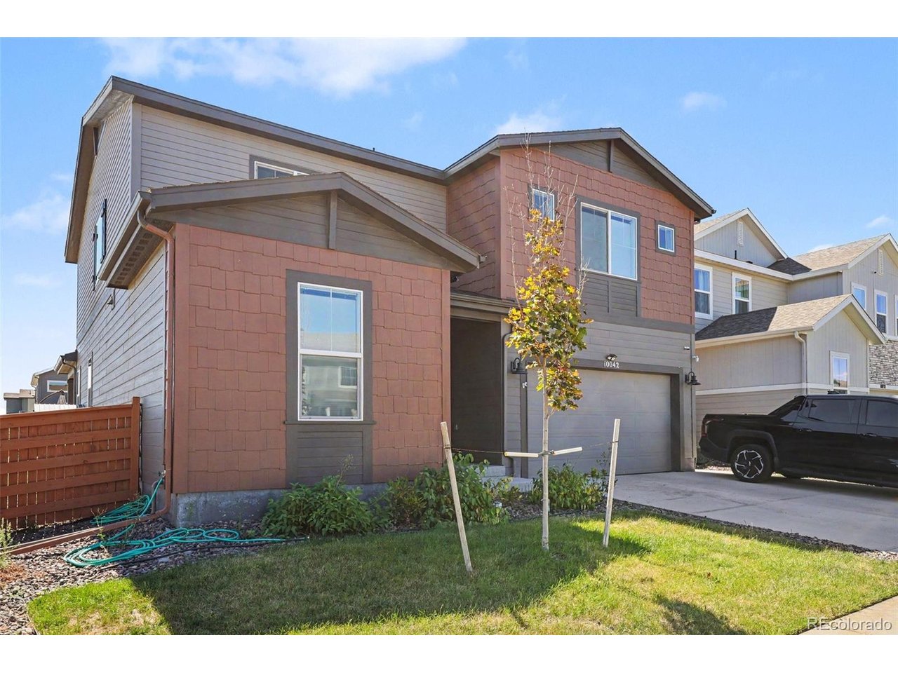 Welcome to this beautifully appointed home in the Reunion neighborhood, where comfort, style, and outdoor living come together! The home is adjacent to beautiful park space. Enjoy access to Reunion's neighborhood pool, recreation center, parks, playgrounds, and miles of walking trails, with trails conveniently located directly across from the backyard. This spacious two-story home features soaring ceilings and an abundance of natural light throughout. The main level offers an open floor plan with engineered hardwood flooring flowing through the living room and connecting effortlessly to the dining and kitchen areas. The upgraded kitchen features granite countertops, a large island, new appliances and abundant cabinetry. The dining space opens through sliding glass doors to an incredible backyard retreat designed for entertaining. Enjoy a beautiful paver patio, covered deck area, and fully turfed backyard for low-maintenance outdoor living.  The main level also features a private office, a spacious bedroom, and a full bathroom with a tub/shower combination for comfortable and convenient multi-generational uses. Upstairs, the generous primary suite features carpet flooring, a walk-in closet, and a luxurious ensuite bathrooms with dual vanities, tile flooring, a large soaking tub, and walk-in shower. Two additional bedrooms, each filled with natural light, provide comfortable accommodations, along with two additional full bathrooms. A convenient upstairs laundry room and loft space add even more functionality. The large unfinished basement provides an exciting opportunity to customize to suit your needs. With its open layout, thoughtful upgrades, abundant natural light, exceptional backyard, and fantastic Reunion amenities, this home offers the perfect combination of everyday living and entertaining! Click the Virtual Tour link to view the 3D walkthrough. Discounted rate options and no lender fee future refinancing may be available for qualified buyers of this home.