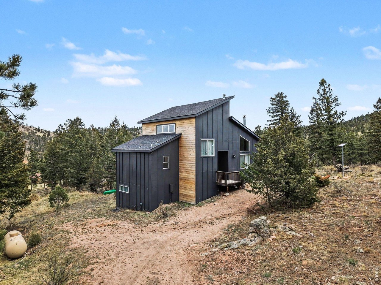 Tucked into the peaceful mountain landscape just 45 minutes from Fort Collins and only 15 minutes to the shops and eateries of Red Feather Lakes, this fully furnished, turnkey cabin on nearly 4 acres offers the ideal blend of seclusion, comfort, and accessibility. With new siding, windows, patio doors, and roof, the exterior has been thoughtfully updated, while the interior preserves its original 1997 charm-warm, inviting, and meticulously maintained by just two owners.This property has been the backdrop for countless memories-from weekend getaways and book clubs to hosting multiple families-all in a quiet, safe community where neighbors genuinely look out for one another. Whether you're seeking a personal retreat or a flexible mountain escape, this cabin delivers.Stay connected with Starlink internet, making it easy to work remotely while surrounded by nature. Step outside to explore nearby trails, including Eagle's Nest and Mount Margaret, or enjoy year-round recreation with sledding and outdoor activities just 30 minutes away at Beaver Meadows Resort Ranch in Crystal Lakes.All furnishings and appliances are included, allowing for a seamless, same-day move-in or immediate enjoyment. Lovingly cared for and truly turnkey, this is a rare opportunity to own a mountain property that's ready to be experienced from day one.