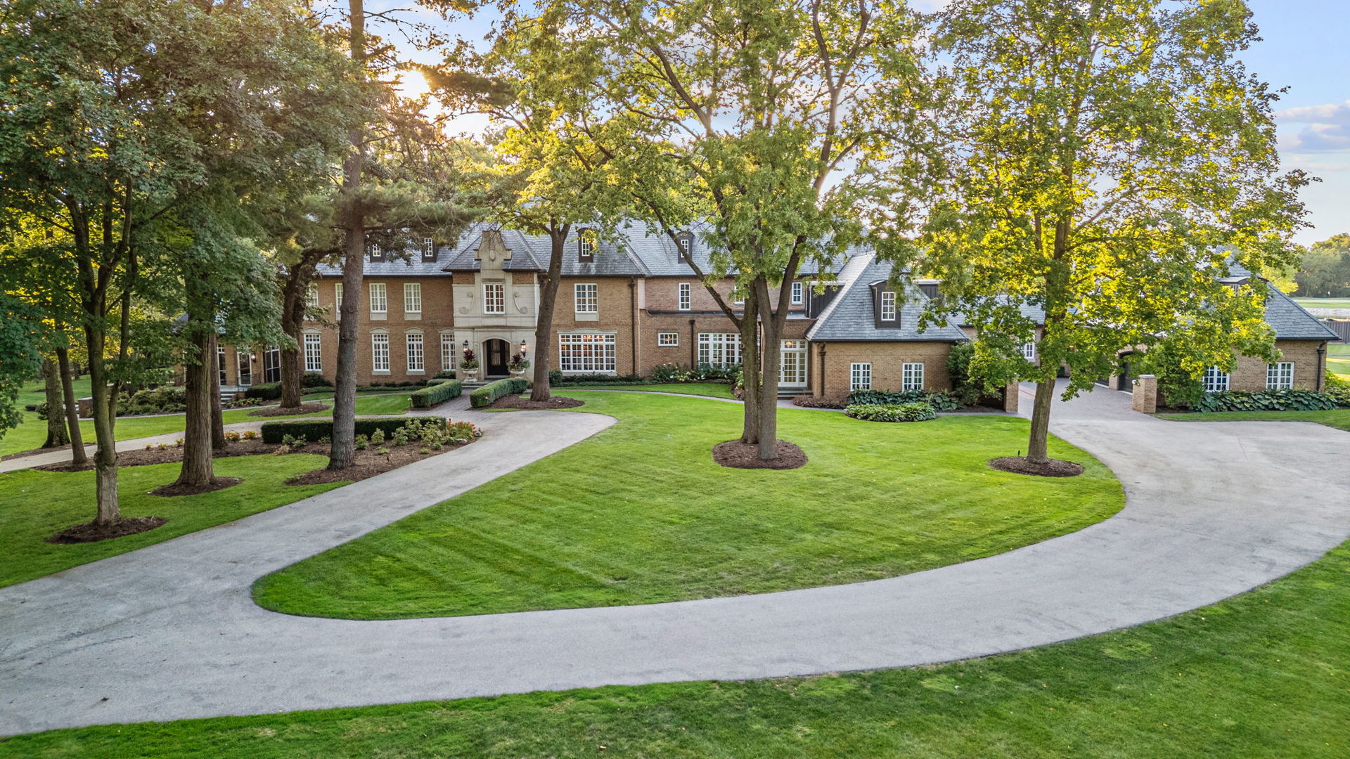 Welcome to the Minkler Estate - a property unlike any other in Chicagoland. Surrounded by beautiful wildflowers, dense woods, and secluded prairie, this extraordinary 36-acre countryside haven offers the perfect blend of privacy, sophistication, and natural beauty.    At the heart of the estate lies a stately 12,000+ sq ft English manor, meticulously renovated from the ground up to combine modern elegance with rustic charm. From barn wood ceilings to stone fireplaces, every detail exudes warmth and character. The chef's kitchen dazzles with marble countertops and high-end appliances, while the primary suite features a private balcony with sweeping views and a spa-inspired bath. Designed for grand living and entertaining, the home also boasts a great room, media room, billiards room, wine cellar, golf simulator, and home theater. With six bedrooms, seven full baths, and two half baths, the residence is as functional as it is breathtaking.    Unmatched Outdoor Lifestyle    The grounds are a dream come true. A dazzling infinity pool, ornate patio, and pool house create a resort-like retreat, while a sport court accommodates both pickleball and basketball. Equestrian enthusiasts will appreciate the horse barn with six stables, paired with an attached garage that fits up to 20 vehicles or off-road toys. A separate, charming historic barn offers a unique venue for weddings, graduations, and celebrations. Outdoors, you'll also find a private shooting range, a chipping golf range, and a scenic 3-acre pond, ideal for fishing or cruising with an electric boat.    Guest & Staff Accommodations    In addition to the main manor, the estate includes a newer 2,000 sq ft detached home, perfect for extended family, guests, or a house manager. The attached main garage comfortably houses at least eight vehicles-with room for lifts and more.    The Minkler Estate is more than a home-it's a lifestyle. From private retreats and equestrian living to lavish entertaining and unforgettable events, this rare offering provides opportunities that simply cannot be found elsewhere in Chicagoland.    Welcome to the Minkler Estate, there is nothing like it in Illinois.