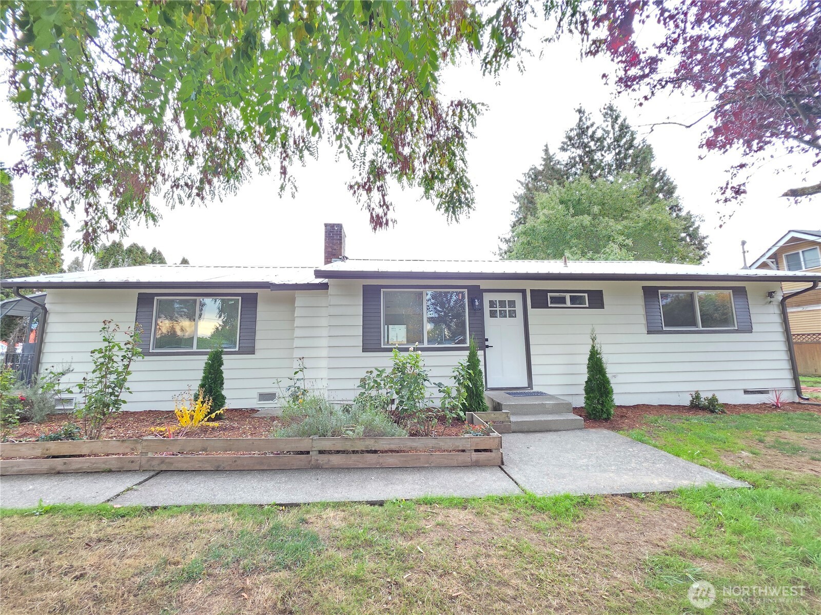 Fully remodeled and beautifully charming, this farmhouse sits on a flat COMMERCIAL lot with plenty of parking, plus ample room for your RV and boat under an oversized 24x35x14ft commercial-grade metal carport with an attached utility shed/shop. Property can be use as a business under C3 Zone right between Kent and Auburn, close to H-167, with walking distance to shops, and restaurants. The home features a durable metal roof, all-new vinyl windows, and a brand-new custom kitchen with flat-panel cabinets, quartz countertops, and quality name-brand appliances. Enjoy gorgeous new bathrooms finished with porcelain tile and modern luxury hardware, along with new AC/mini-split systems and luxury vinyl flooring throughout.