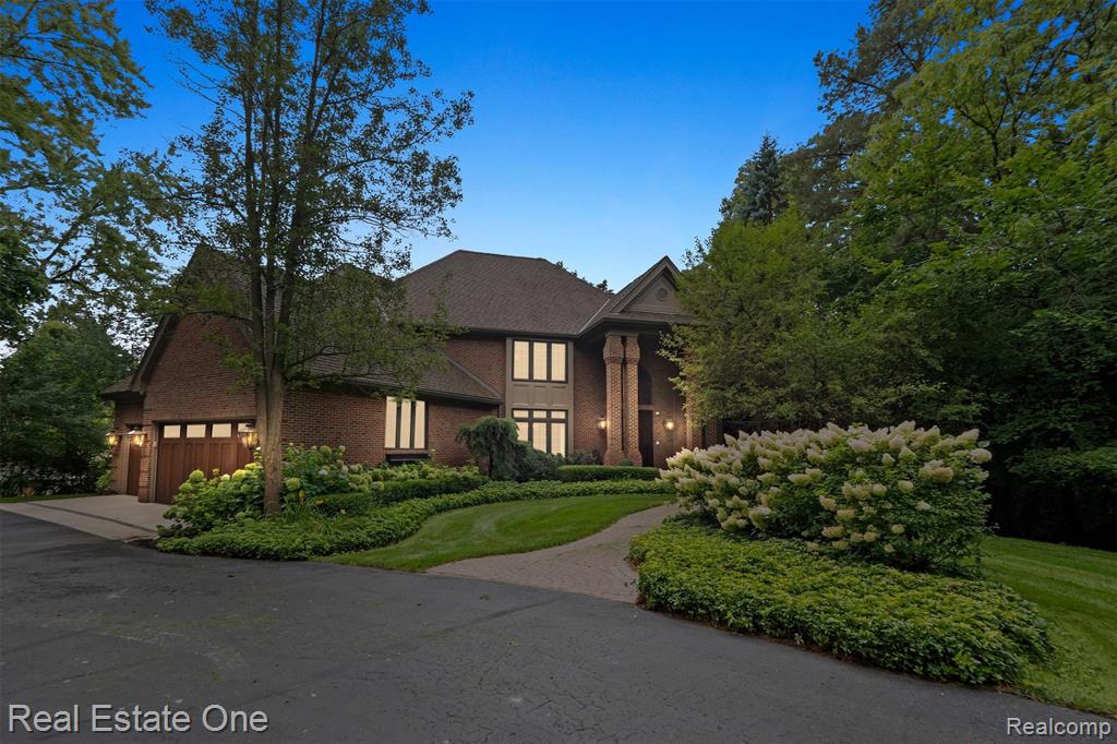 Rare opportunity to experience unmatched luxury and privacy on Clarkston’s prestigious Gold Coast of All-Sports Deer Lake. Set on 1.2 private acres, this nearly 7,000 sq ft residence combines timeless elegance with modern comfort and breathtaking west-facing lake views. Fully remodeled in 2013, every element was thoughtfully designed with meticulous attention to detail. The dramatic two-story great room features coffered ceilings, custom millwork, floor-to-ceiling windows and a showpiece two-sided stone fireplace designed by the creator of the Ritz-Carlton Bachelor Gulch. Additional highlights include custom gas lamps, bespoke millwork, crown molding, heated tile flooring throughout, and a full house generator, for more comprehensive specs SEE ATTACHED FEATURE LIST FOR FULL DETAILS!  The chef’s kitchen includes premium integrated appliances, a large island, custom cabinetry, a walk-in pantry with an office nook, a Miele coffee system, beverage fridge, and a service bar with wine cooler, ice maker, and bar sink. The primary suite boasts panoramic lake views, a custom walk-in closet and a spa-inspired bath with a Jacuzzi tub and steam shower. Upper-level features en-suite bedrooms, a private guest suite and a bonus room with spectacular views. Walkout lower level offers a second full kitchen, media/family room, private den with hidden storage and safe, full bath, and expansive storage. Heated 3+ car garage with golf cart access, hot and cold water and storage systems, and attic with pull down access. This home provides an “up-north” feel while remaining just a short walk to the charming Village of Clarkston. Boutique shops, dining, and local amenities are moments away, making this an unparalleled opportunity to enjoy both serene waterfront living and effortless access to community life. This lakefront is an incredible value and a rare opportunity to live on one of Oakland County’s treasured lakefronts.