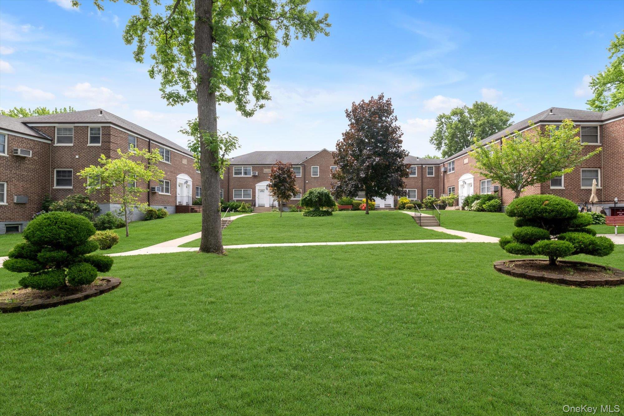 Deepdale Gardens One Bedroom Lower Corner Unit Located in a Tree Lined Courtyard in Great Location. This Sun Soaked Co-op Unit Features New Recessed Lighting, Updated Kitchen with Plenty of Cabinetry, Ceramic Tiled Floor, Quartz Countertops, Ultra Convenient In-Unit Washer, Dryer & Dishwasher, and a Beautiful Open Kitchen Wall Pass Through With Eat-in Breakfast Bar.  Open Concept L-Shaped Living Room and Dining Area is Great for Entertaining, and Custom Built Wall Mounted Folding Desk Making For Versatile Flex Work Space if Needed. Oversized Bright Bedroom with Two Corner Windows for Plenty of Sunlight, Modern Sliding Closet Doors, Finished with Closet System. Tiled Bathroom with Marble Pencil Tile Trim and Stone Tiled Flooring. Additional Features Include Co-op Approved Flooring,  Two Air Conditioners, Chair Rail Molding, Unit Recently Painted, Convenient Access to Large Parking Lot Nearby, and Large Walk-In Living Room Closet for Plenty of Extra Storage Space. Current Maintenance Includes All Utilities (Including Electric), Taxes and Parking. No Flip Tax. Close To All Shops, Schools and Transportation.