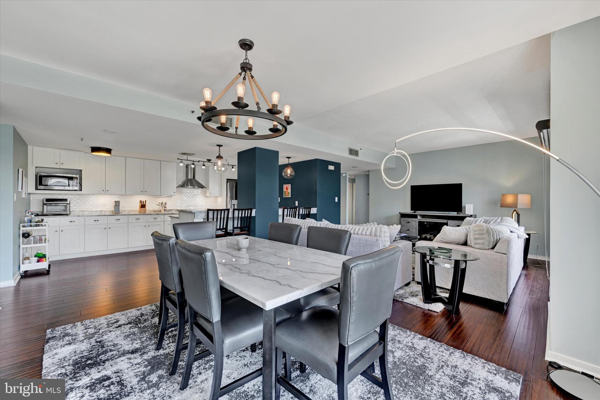 Welcome to Scarlett Place, one of Baltimore's premier waterfront condominium communities! This beautifully updated 2-bedroom, 2-bath residence offers breathtaking harbor views and an unbeatable location just steps from Little Italy, Fells Point, Harbor Point, and the Inner Harbor. Inside, you'll find brand-new Premium luxury Cali-Bamboo flooring throughout, creating a fresh and modern feel. The owner has thoughtfully enhanced the home with upgraded shower doors on both tubs, new toilets, and replacement of major appliances including the refrigerator, dishwasher, hot water heater, washer, and dryer for added peace of mind. The spacious layout is perfect for everyday living and entertaining while showcasing stunning water views. This unit also includes a deeded parking space and an additional private storage area. Scarlett Place offers an exceptional lifestyle  including an indoor pool, sundeck, fitness center, community room, resident library, game room, and a 24-hour staffed front desk. Enjoy the resort style sundeck featuring grilling amenities, comfortable lounge seating, and umbrella shaded relaxation areas. Whether you're looking for a full-time residence or a low-maintenance city retreat, this move-in-ready home places the very best of Baltimore right outside your door.