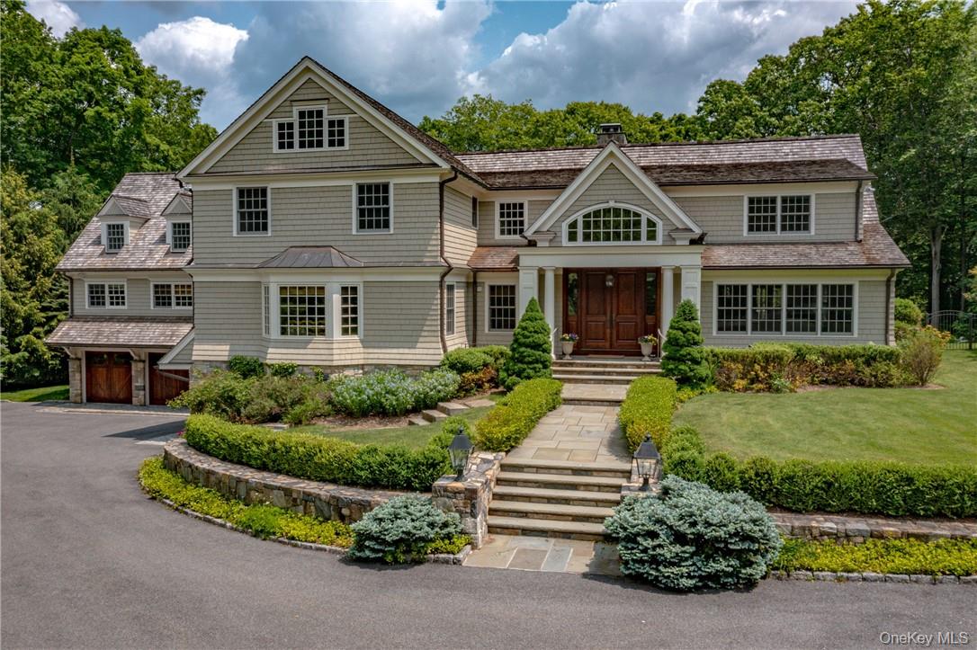 Welcome to 70 Haights Cross, an architectural masterpiece in one of Chappaqua’s most coveted neighborhoods. Designed by acclaimed architect Tasos Kokoris, this turn-key 5-bedroom, 7.2-bath colonial blends timeless elegance with today’s most sought-after amenities. Nestled on over two acres of private, professionally landscaped grounds, the property showcases a resort-like setting with a Gunite pool, waterfall, and jacuzzi. Perfect for both everyday enjoyment and entertaining. Inside, the heart of the home is the sun-drenched gourmet kitchen, thoughtfully outfitted with a Wolf 6-burner range, warming and fridge drawers, dual Bosch dishwashers, and a Subzero refrigerator. An expansive family room with a gas fireplace, a rich wood-paneled library with wood-burning stove, a sophisticated home office, and an upstairs gathering room create spaces designed for comfort and connection. The lower level elevates the lifestyle experience with a dramatic garden room opening to a stone patio, two full baths, a recreation room, lounge, sitting area, and mudroom. Bordering the scenic Glazier Arboretum and its tranquil hiking trails, this home offers the perfect balance of luxury and nature. Located within the highly sought-after Chappaqua School District, 70 Haights Cross is more than a residence, it’s a lifestyle. Experience the pinnacle of Westchester living in a private and serene retreat, just minutes to Chappaqua village, train, and parkways.