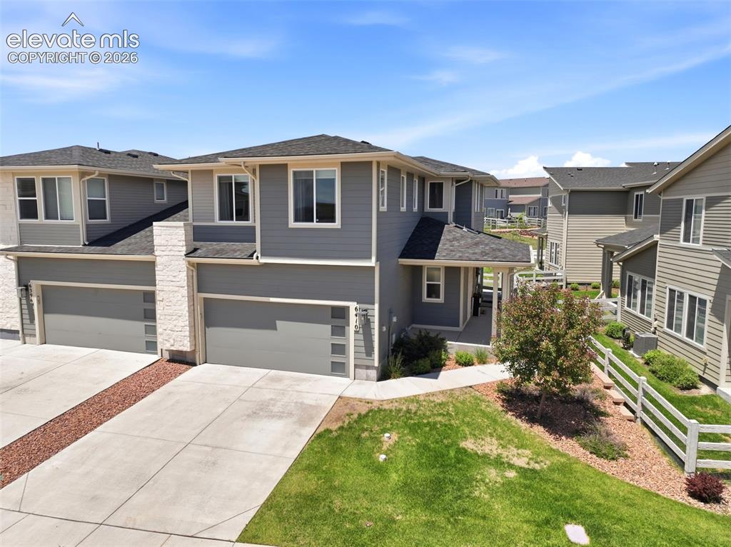 Welcome to this beautifully maintained townhome in the heart of Wolf Ranch, just moments from the lake, recreation center and community amenities. Built in 2020, this home feels better than new and offers the perfect blend of modern finishes, thoughtful upgrades and convenient low-maintenance living * Curb appeal is a "10" showcasing a very modern design with stylish stone accenting * Covered front entry a plus * Durable luxury vinyl plank flooring flows abundantly throughout the main living areas creating a warm and inviting atmosphere * The gourmet kitchen is designed to impress with quartz countertops, upgraded 42-inch cabinetry, large center island, gas range, spacious pantry and convenient coffee bar * Enhanced lighting throughout the home adds style and sophistication to every space * The open-concept main level seamlessly connects the kitchen, dedicated dining area & living room * Open space is great for entertaining offering access to the partially covered rear patio, thoughtfully expanded creating an ideal outdoor haven for relaxing or enjoying Colorado's beautiful weather and sunsets * 1/2 bath on main is conveniently located * Focal, open staircase ascends to the upper level promoting the oversized primary suite serving as a private retreat, featuring a well-appointed bath with dual vanities, oversized tiled shower and a generous walk-in closet with organized built-in shelving * Two additional bedrooms, a full bath and a conveniently located laundry room provide comfort and functionality for easy everyday living * Located within the award-winning Wolf Ranch community, residents enjoy access to nearly 400 acres of parks and open space, a lake, recreation center, Jr. Olympic-sized pool, splash park, fitness programs, community events, walking trails and countless opportunities to enjoy an active Colorado lifestyle. Award winning District 20 School are a bonus * Move-in ready, thoughtfully upgraded and ideally located—this is Wolf Ranch living at its best...