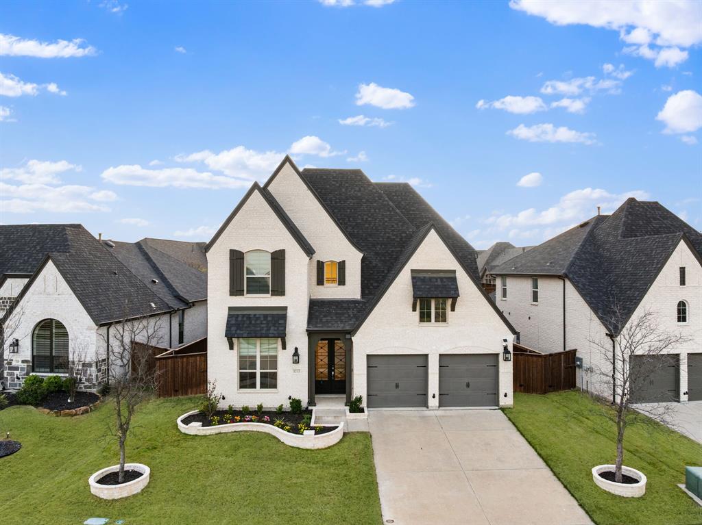 Situated in the highly sought-after Trinity Falls community, this beautifully designed home offers a refined blend of modern design and functionality with soaring ceilings, abundant natural light, and carefully selected finishes throughout. The open-concept layout features a well-appointed kitchen with quartz countertops, an oversized island, stainless steel appliances including a gas cooktop, and a spacious walk-in pantry, all seamlessly connected to the dining area and expansive living room highlighted by a fireplace and two-story windows. The main-level primary suite provides a private retreat with a spa-inspired bath complete with dual vanities, a soaking tub, separate walk-in shower, and generous closet space. A dedicated media room creates the perfect setting for entertainment, while the oversized upstairs game room and additional flex space offer versatility for work, play, or multi-generational living. Thoughtful details including designer lighting, wide-plank flooring, a mudroom with built-ins, and a well-appointed laundry room enhance everyday convenience. Secondary bedrooms are generously sized with access to well-finished bathrooms. Residents of Trinity Falls enjoy resort-style amenities including multiple pools, a clubhouse, fitness center, scenic trails along the Trinity River, parks, playgrounds, and a strong sense of community, all within close proximity to shopping, dining, and top-rated schools.