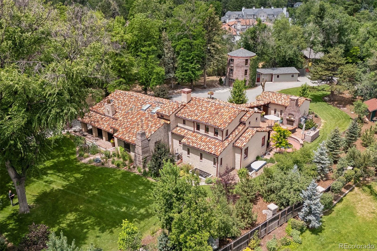 Please join us at our open house Tuesday Jan 27 from 11am-1pm.  We happily present this exquisite and unique 1927 Spanish revival estate that has just undergone a thoughtful and EXTENSIVE RENOVATION AND ADDITION. The next owner will certainly appreciate the privacy, tranquility and historic charm of this enchanting one acre property (one of the neighborhood's original farm houses), nestled between Tufts Avenue and Stanford Avenue in Old Cherry Hills. The main house, silo and casita total 5 Bedrooms • 8 Bathrooms • 2 Studies. Redefined for today’s lifestyle, the multi-year project included an addition of a new wing to the home that allows for a gorgeous main floor primary suite and laundry room and an enlarged basement that is now complete with a new full gym, wet bar, wine tasting cellar and home theater. The top to bottom renovation tripled the size of the kitchen and included all new electrical, HVAC, plumbing, retexturing of walls, 6 skylights, 5 egress windows and hand removal of the original clay tile roof which were mixed with new clay tiles to create a new seamless Spanish style roof. All new hardscaping around the home, a new outdoor kitchen, wood burning fireplace, sprinkler system, new garage, many new trees and shrubs, heated driveway under half of roundabout closest to main house, new hot tub and both entry gates (with remotes) have Doorbird keypads with video and hard switches to open from main house. The 3 story silo (built in the 1880s) was also just renovated and now houses a wonderful study, TV room. The guest casita has new wood floors, a kitchenette, full sized murphy bed and ¾ bathroom and French doors to a private patio. The renovation of the silo, casita and 2 car garage included structural work, new windows, roof, lighting and mini splits for heating and AC. Tons of parking and so many beautiful spaces indoor and out for entertaining. The silo is just the beginning… Please come take a look!