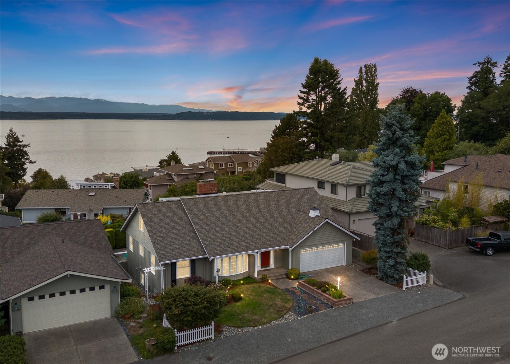 Where legacy, lifestyle, & location converge. Introducing a Richmond Beach original—on the market for the very first time. Sweeping Puget Sound & majestic Olympic Mountain views, this NW Contemporary offers nearly 4,600 sq ft of timeless architecture & soulful design. A dramatic grand entry with a sweeping staircase & striking glass chandelier sets the tone, while elegant living spaces & a light-filled layout offer seamless flow. An expansive view deck & sparkling in-ground pool turn the backyard into a private escape. Tucked at the end of a quiet street in one of Shoreline’s most coveted neighborhoods, this home was deeply loved by its original owner & holds a special place in Seattle’s music history. Rare! Remarkable! Yours to discover!!!