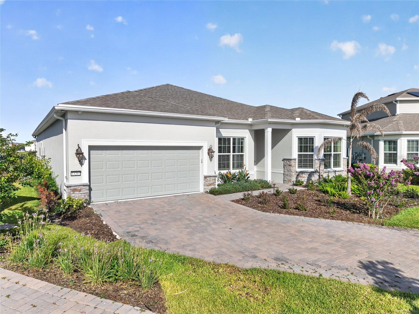 Completely Furnished & Decorated — Move-In Ready. A rare and unrepeatable opportunity in one of Orlando's most coveted addresses: welcome to Isles of Lake Nona, where luxury, privacy, and lifestyle converge in this impeccably crafted 2025-built residence. Delivered fully furnished, decorated, and equipped to the highest standard, this is the home where nothing is left to imagination and everything exceeds expectation. Spanning 3,810 square feet of thoughtfully curated living space on a single level, the residence offers three bedroom and three and one-half baths, positioned on a premium 0.23-acre waterfront lot (9,978 sq ft) that ensures unobstructed views, absolute privacy, and a sense of tranquility that is simply irreplaceable.Every element of this home was selected with intention. Every interior item conveys with the property a masterfully curated collection of high-end furniture across all living spaces, custom built-in millwork in the dining room, bedrooms, and media room, contemporary décor of impeccable taste, designer rugs, flat-screen TVs in every room, a premium coffee station, a wine cooler, and a state-of-the-art security system. Nothing was overlooked. Nothing was compromised. At the heart of the residence, the gourmet kitchen stands as a statement of culinary sophistication premium KitchenAid stainless steel appliances, a gas range, LED-lit cabinetry, a walk-in pantry, and a gorgeous island that invites both intimate mornings and grand entertaining alike.The seamless transition between indoor and outdoor living is nothing short of extraordinary. The covered lanai opens to a world-class entertaining space featuring a fully equipped summer kitchen with stainless steel gas grill, sink, and built-in refrigerator, complemented by a custom pergola, designer outdoor furniture, and a patio heater ensuring every season in Florida is enjoyed in absolute comfort and style. Additional appointments include a private home office, a generously sized laundry room with premium washer and dryer, and an epoxy-finished three-car garage. The sellers spared no expense, selecting every upgrade offered by the buider Pulte a testament to the uncompromising standard of quality that defines every corner of this exceptional home.As a resident of the exclusive gated enclave of Isles of Lake Nona, you will enjoy resort-style amenities including a clubhouse and community pool, all within minutes of Lake Nona Medical City, the planned Lake Nona West shopping center, the USTA National Campus, Adventure Waterpark, and Orlando International Airport. Convenience, prestige, and serenity all in one address. Opportunities like this do not come twice. This is not simply a home for sale. This is a statement of living fully realized, impeccably appointed, and ready for those who accept nothing less than the finest.
