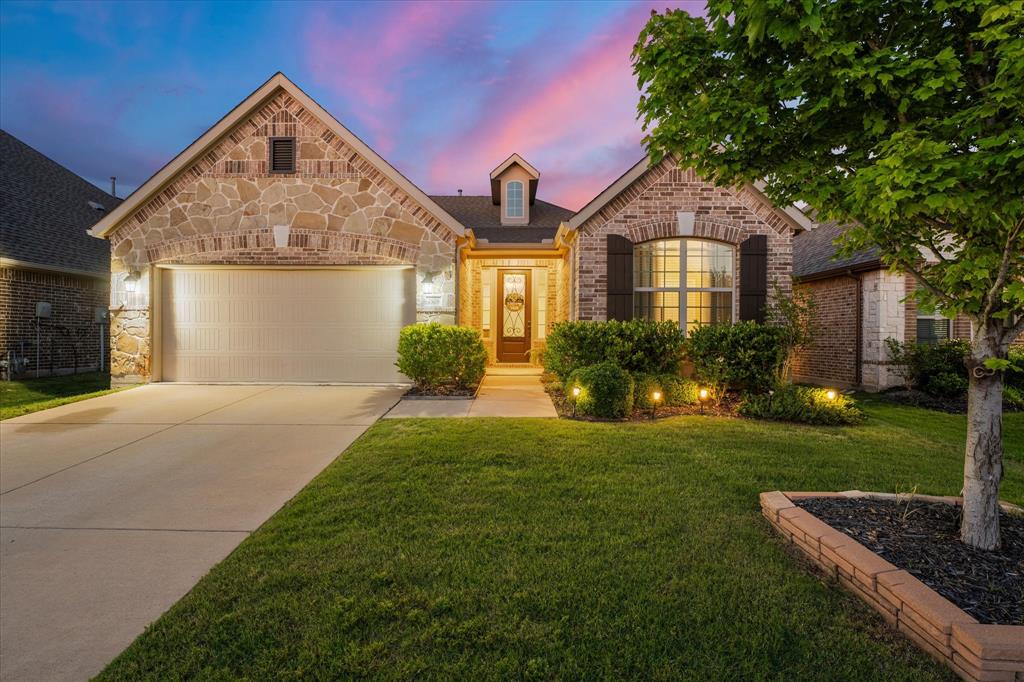 Welcome home to this fabulous one-story gem nestled in the highly sought-after master planned community of Trinity Falls in McKinney! Built in 2017, this beautifully designed home offers the perfect blend of warmth, elegance, and functionality—ideal for first-time homebuyers, empty nesters, or anyone looking for spacious living in an amenity-rich community. Featuring 3 bedrooms, 2 bathrooms, and situated on an oversized lot, this home is loaded with upgrades throughout. Step inside to gorgeous hardwood floors flowing seamlessly through the open-concept floor plan, creating an inviting space perfect for everyday living and entertaining. The dreamy kitchen is every chef’s delight with upgraded appliances, abundant cabinetry, and a layout that opens beautifully to the spacious living and dining areas. The stunning laundry room features custom new cabinetry for both style and convenience. Retreat to the oversized primary suite complete with charming bay windows, a huge walk-in closet, and a spa-like bathroom featuring a spacious walk-in shower. The split-bedroom floor plan provides privacy and flexibility for guests or family members. Enjoy peaceful evenings year-round on the screened-in back patio, complete with an electric screen system on one side allowing you to open up the space and enjoy the beautiful backyard. From the gorgeous landscaping in both the front and back yards to the elegant wrought iron front door, every detail of this home has been thoughtfully designed. Living in Trinity Falls means enjoying incredible amenities including community pools, parks, scenic nature trails, playgrounds, an amenity center, and endless opportunities for outdoor fun and relaxation. This move-in ready home truly has it all—style, comfort, upgrades, and an unbeatable location. Come see why you will LOVE this HOME!