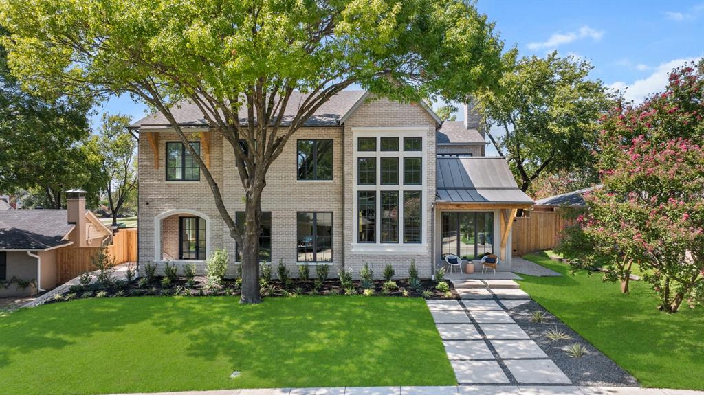 Luxurious and spacious, coastal-inspired new construction in the heart of Lake Highlands! Situated on an oversized lot on a picturesque tree lined street with gorgeous views. This breathtaking home spares no expense or attention to detail with over $250K in upgrades and offers the perfect floorplan and efficient use of spaces. The double vaulted grand entry with showcase staircase welcomes you into the home which features 5 ensuite bedrooms, one located downstairs perfect for guests or a MIL suite. Formal dining with butlers, study, dual staircases, oversized utility room, designated pool bath and media room are just a few highlights of this magnificent home. Thoughtful details such as archways, custom millwork, museum finish walls, window placement, hardwoods throughout, oversized garage, dual dishwashers and multiple outdoor spaces make this home a true custom masterpiece. Commercial grade Wolf appliances, built-in Sub-Zero fridge, Dual Trane HVAC units, Tankless water heaters, aluminum windows, electric privacy gate and designer finishes elevate this stunning property, no detail was spared in the design and build, it's a Must See!